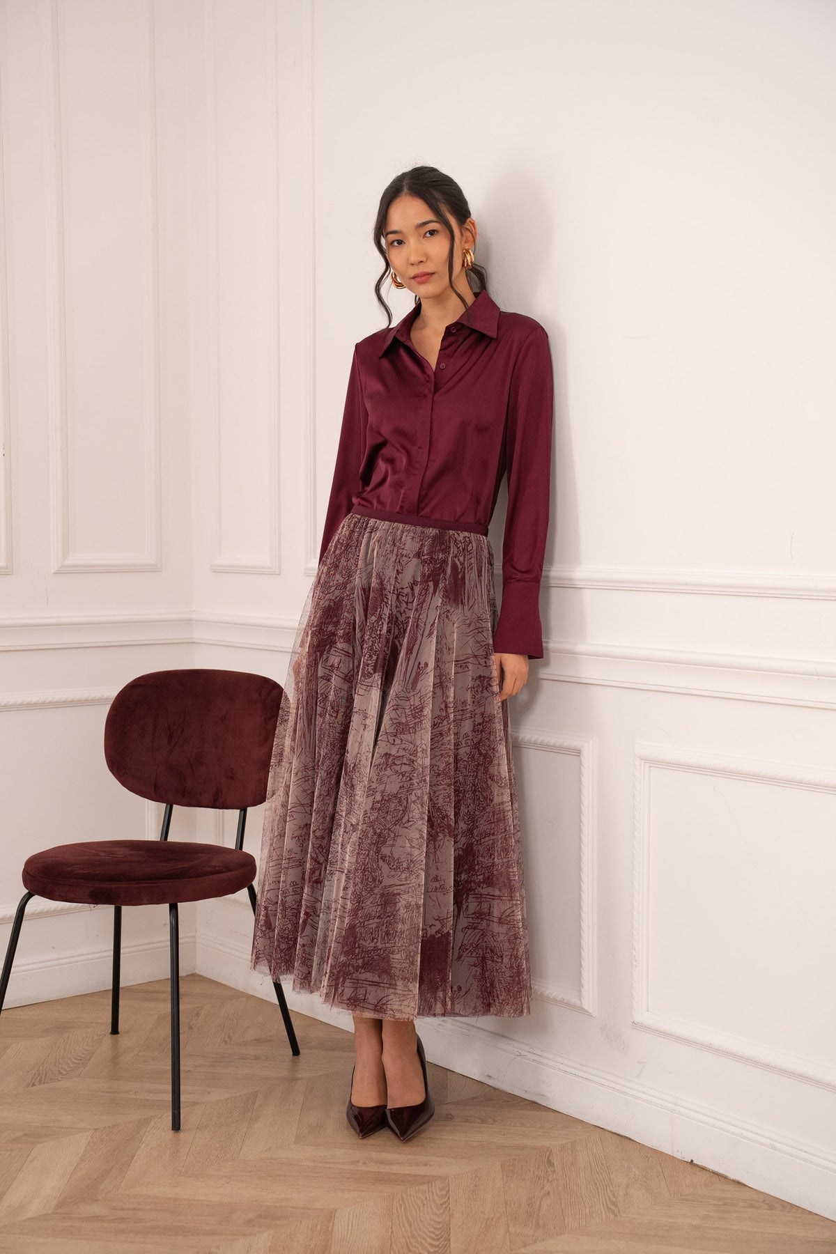 Burgundy printed tulle midi skirt with layered A-line silhouette and contrast waistband.