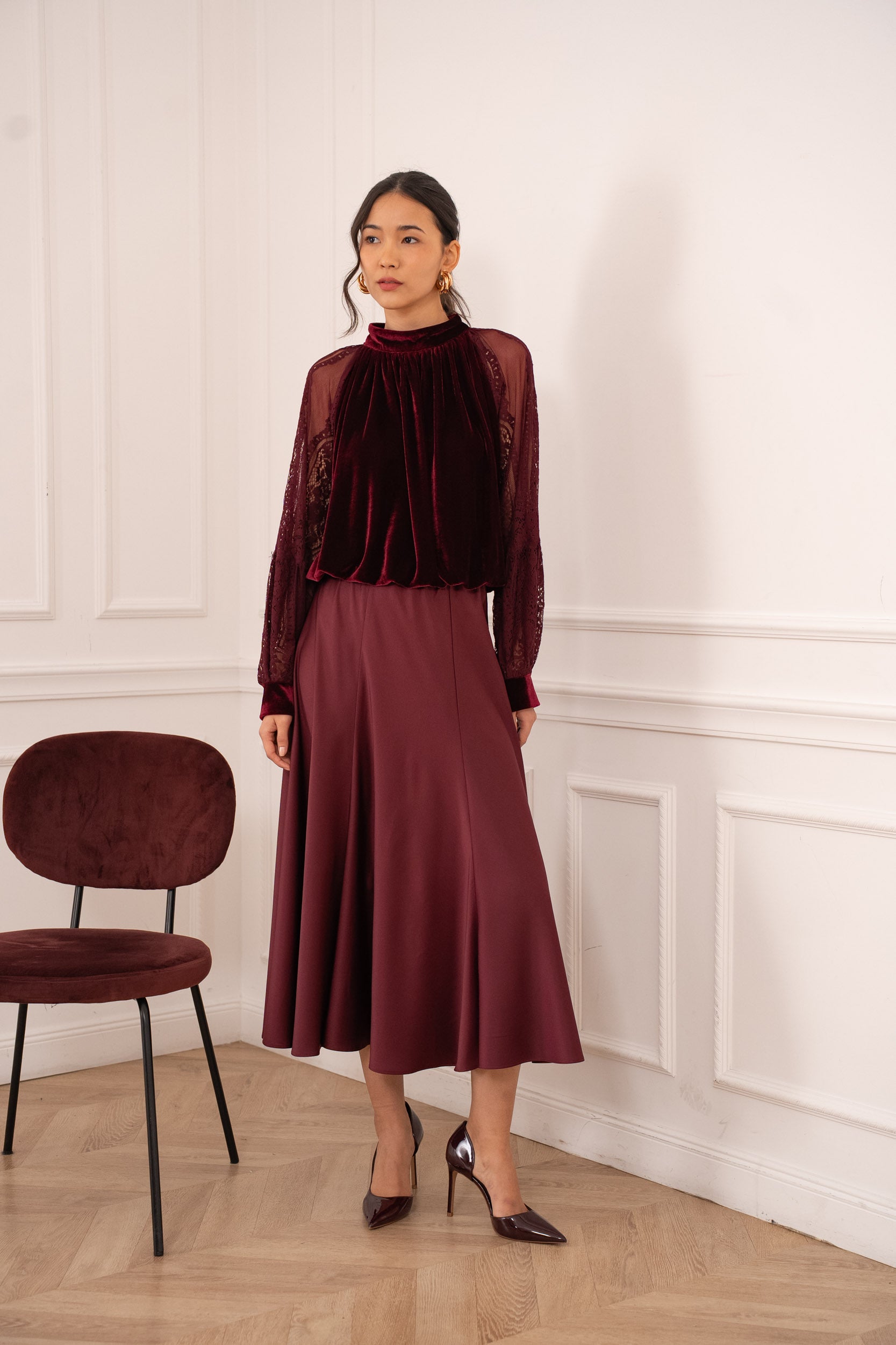 Burgundy velvet blouse with lace sleeves and high neck - front view on model