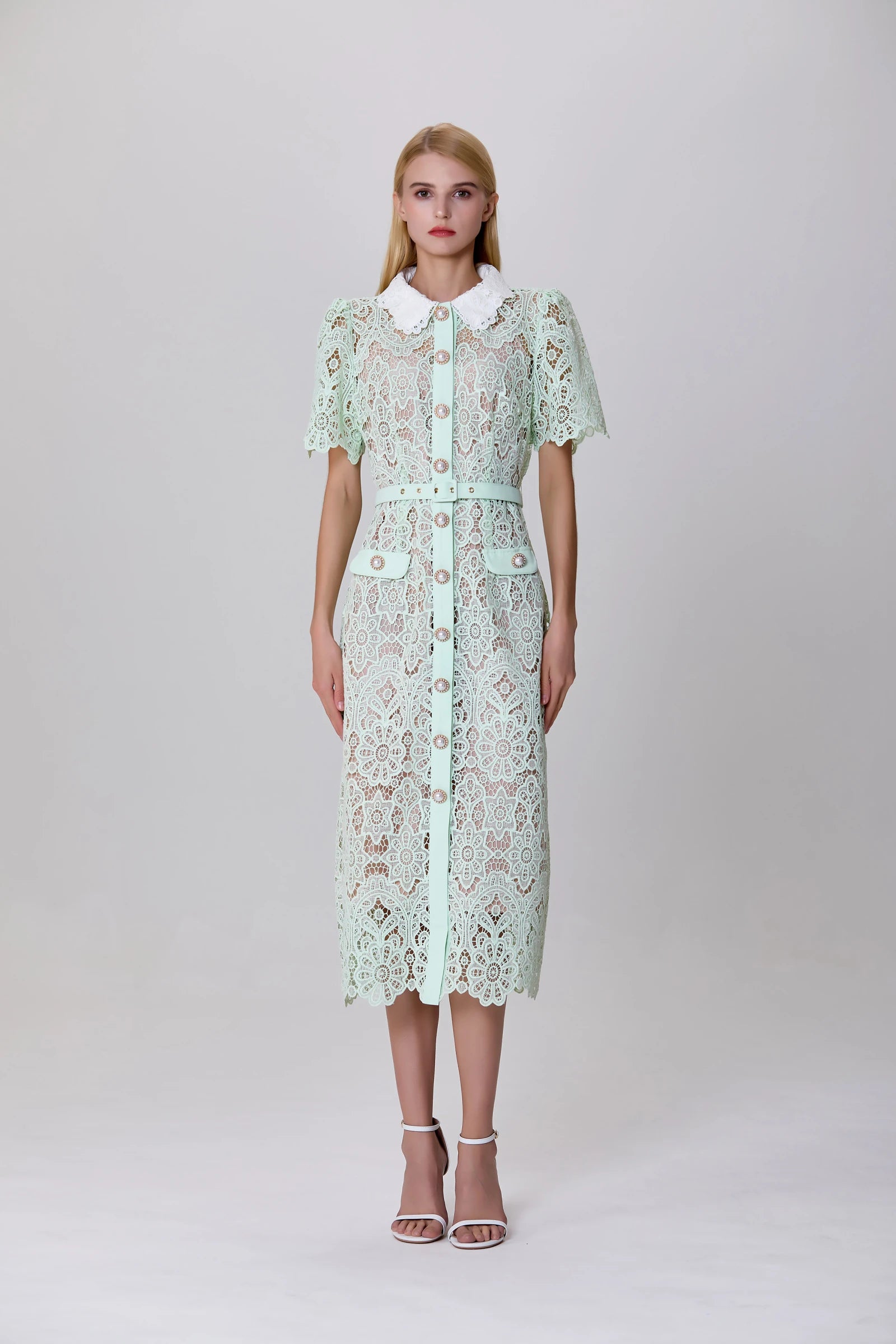 model in mint green lace midi dress with short sleeves and collar