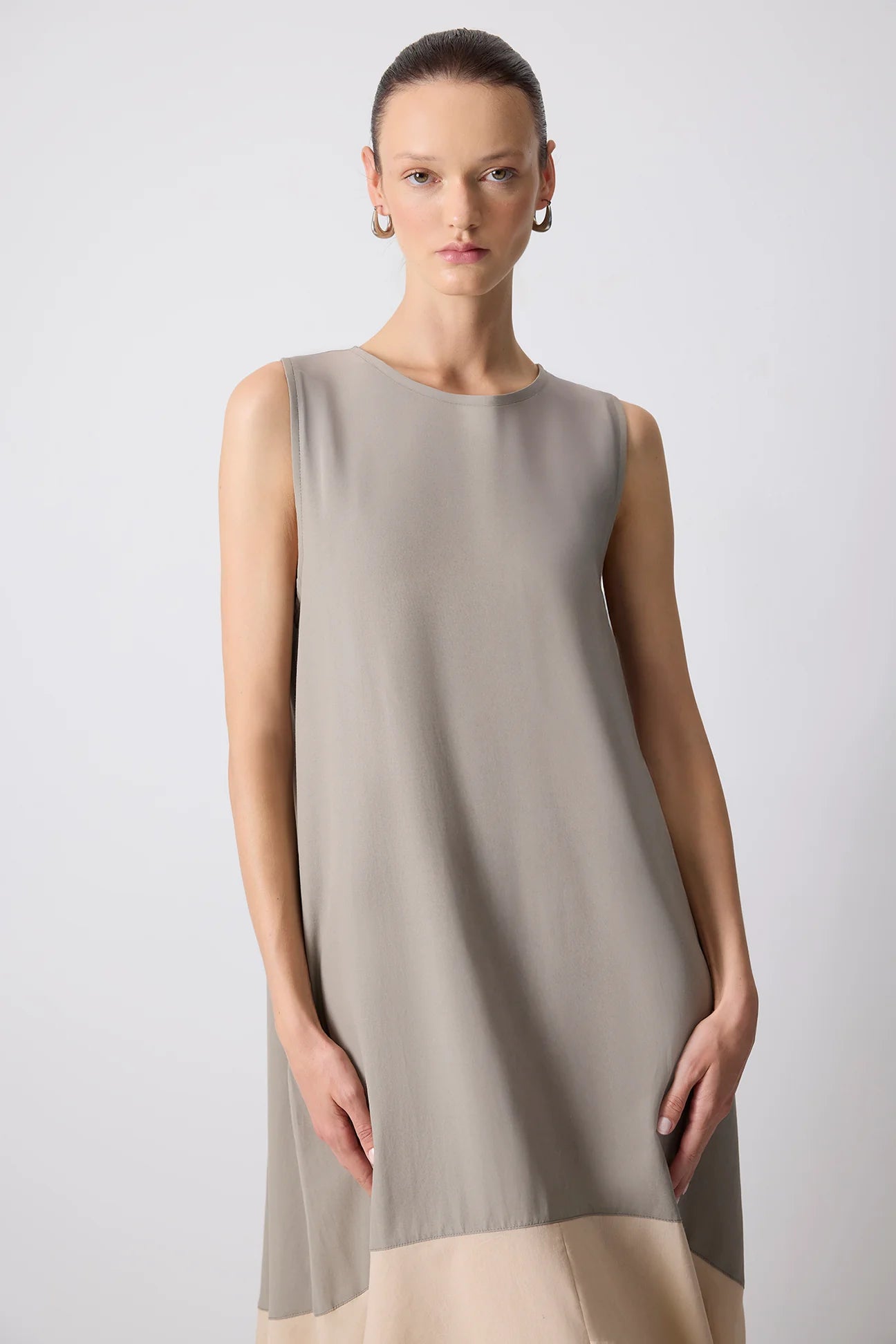 Colour block detail at hem of sleeveless cotton poplin dress