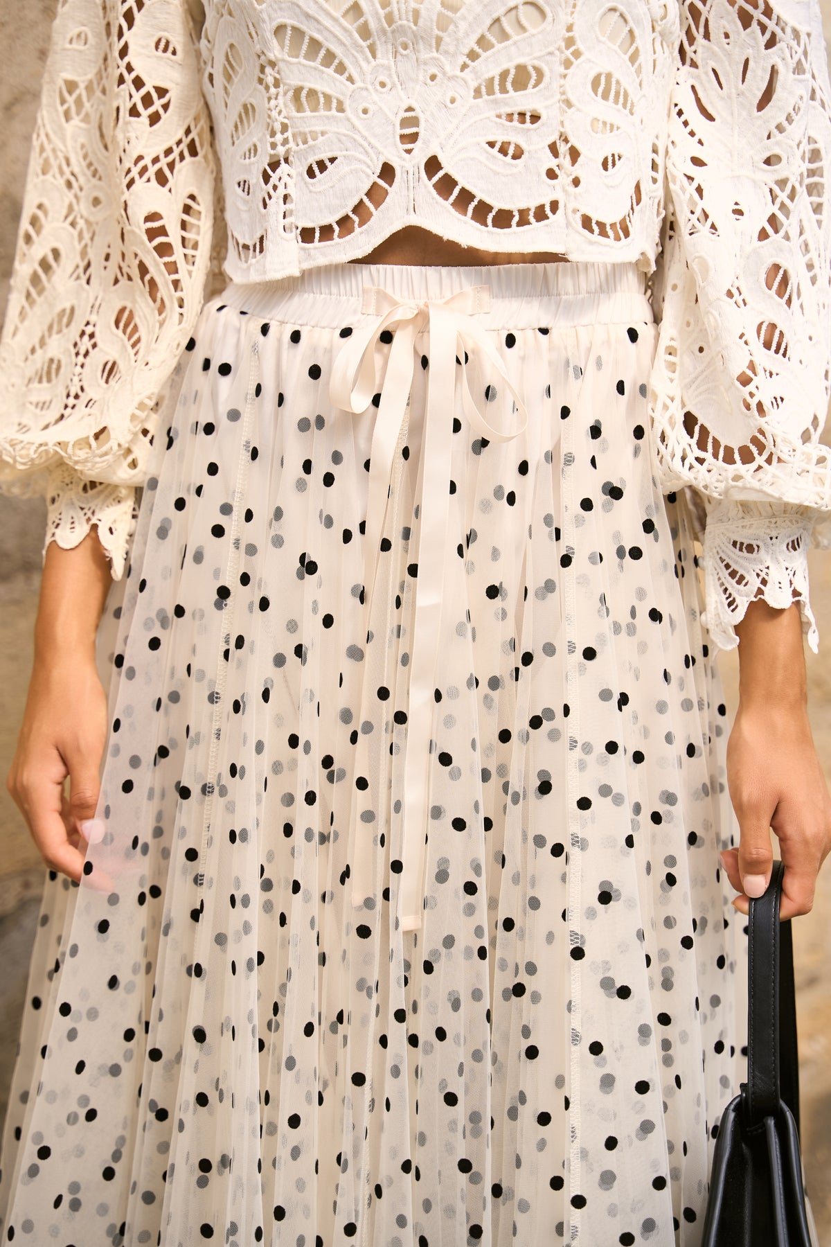 Cream layered tulle midi skirt with black polka dots and satin tie waist