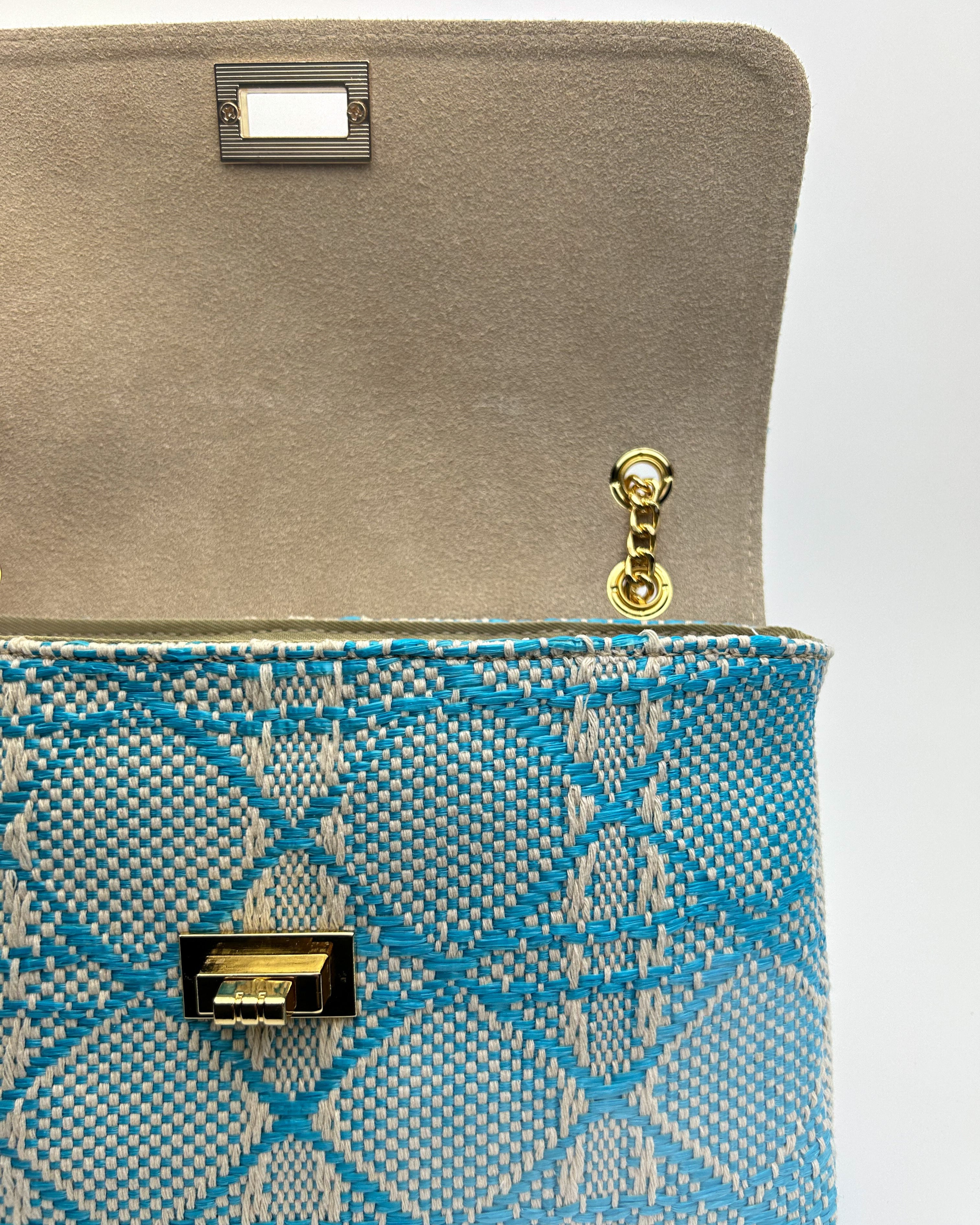 Interior view of Emma blue bag showing leather lining and pockets
