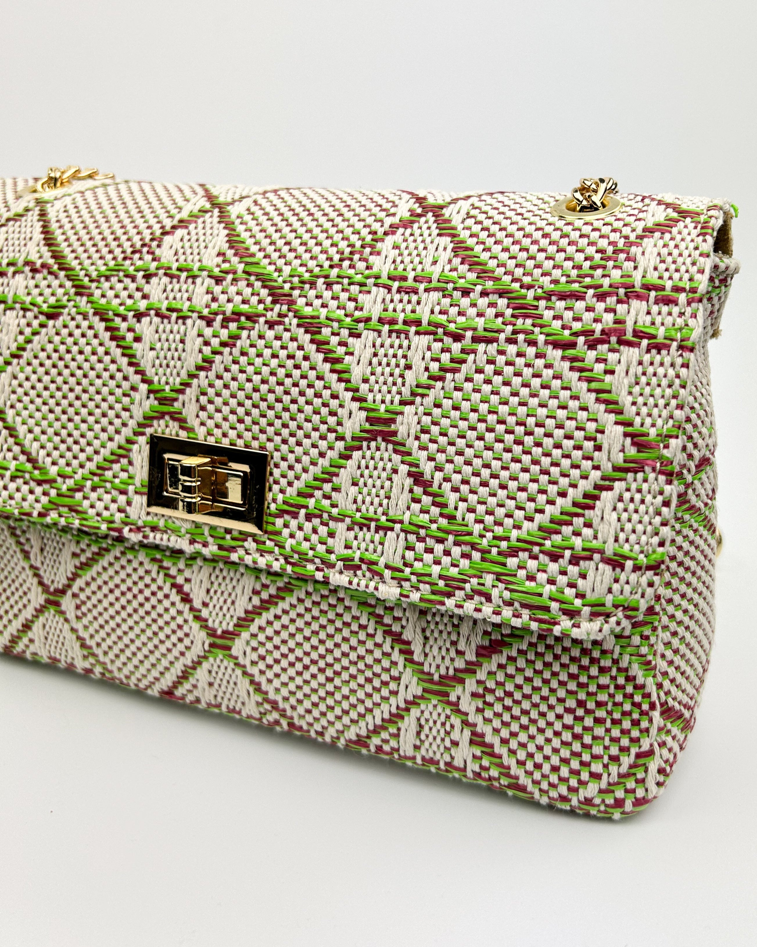 Side profile of Emma lime green multicolour woven fabric and leather bag with gold chain handle – luxury shoulder bag