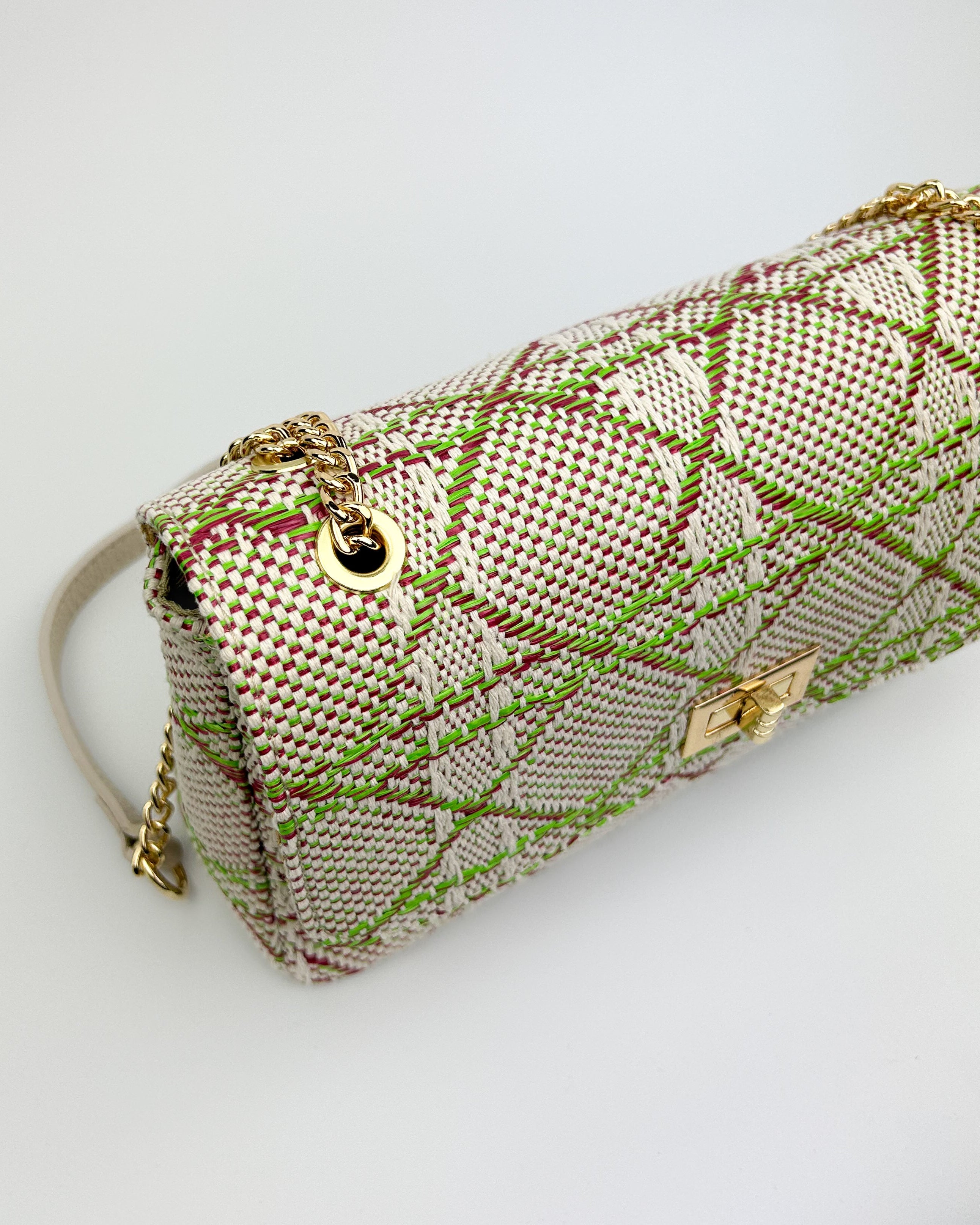 Detail of gold chain strap on Emma shoulder bag – luxe hardware on lime green and leather designer handbag