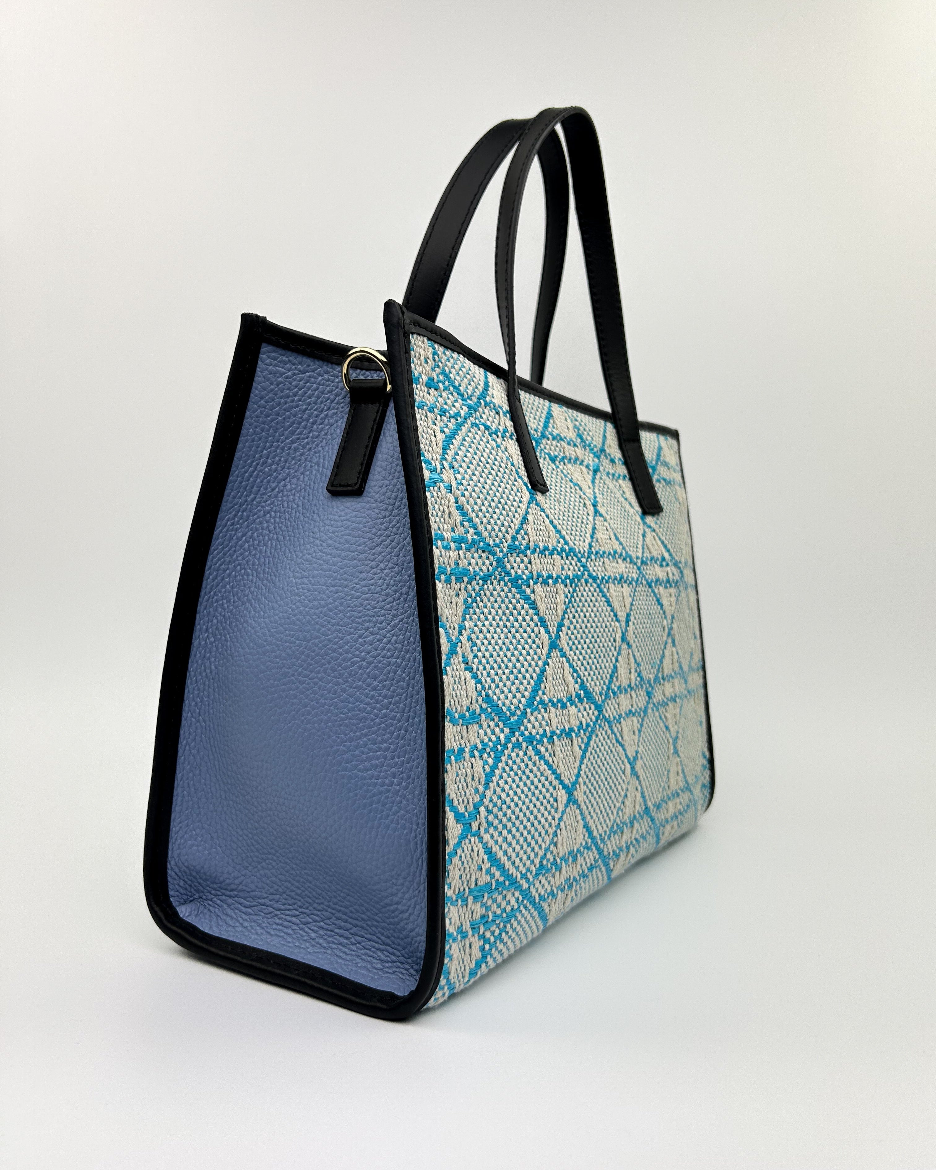 Elegant blue woven Emma Tote with leather top handle and crossbody strap