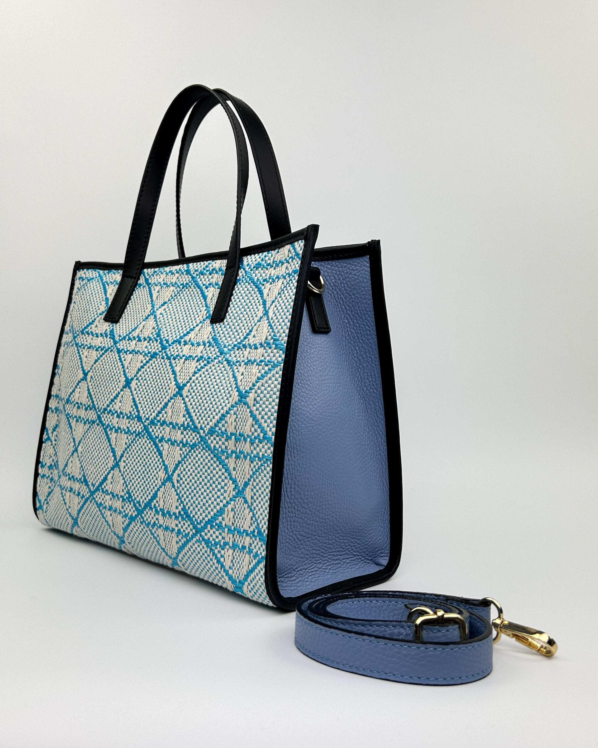 Detail of Emma Tote in deep blue, featuring Italian leather and artisanal texture