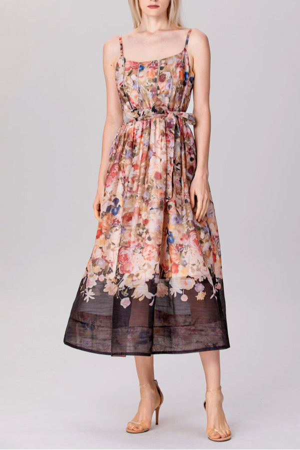model in sleeveless floral organza midi dress with tie waist