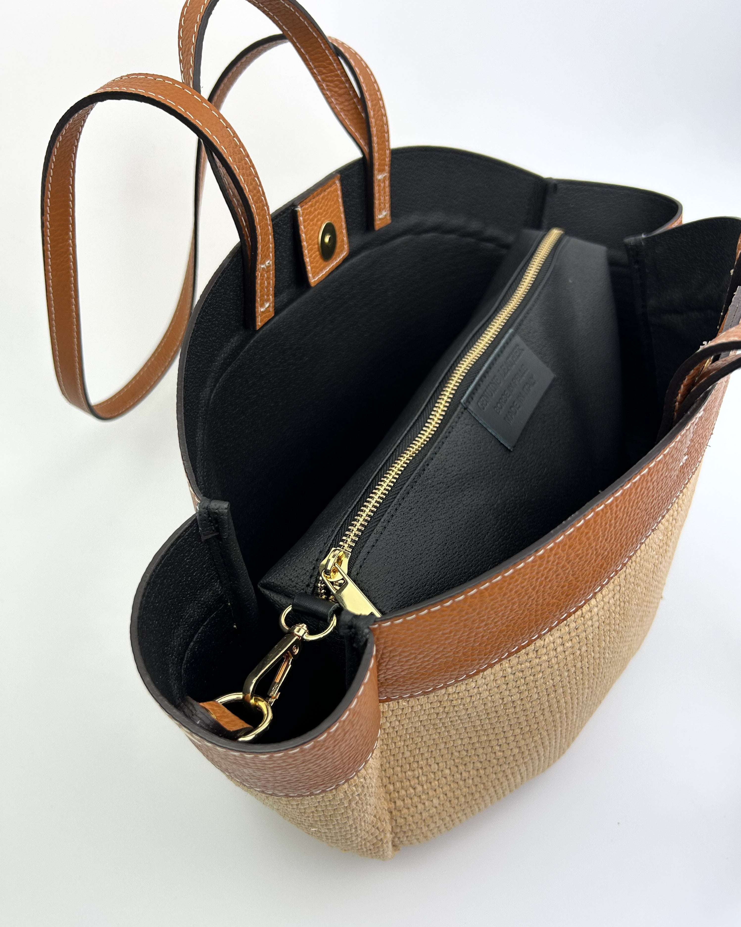 Inside view of raffia bag with brown leather
