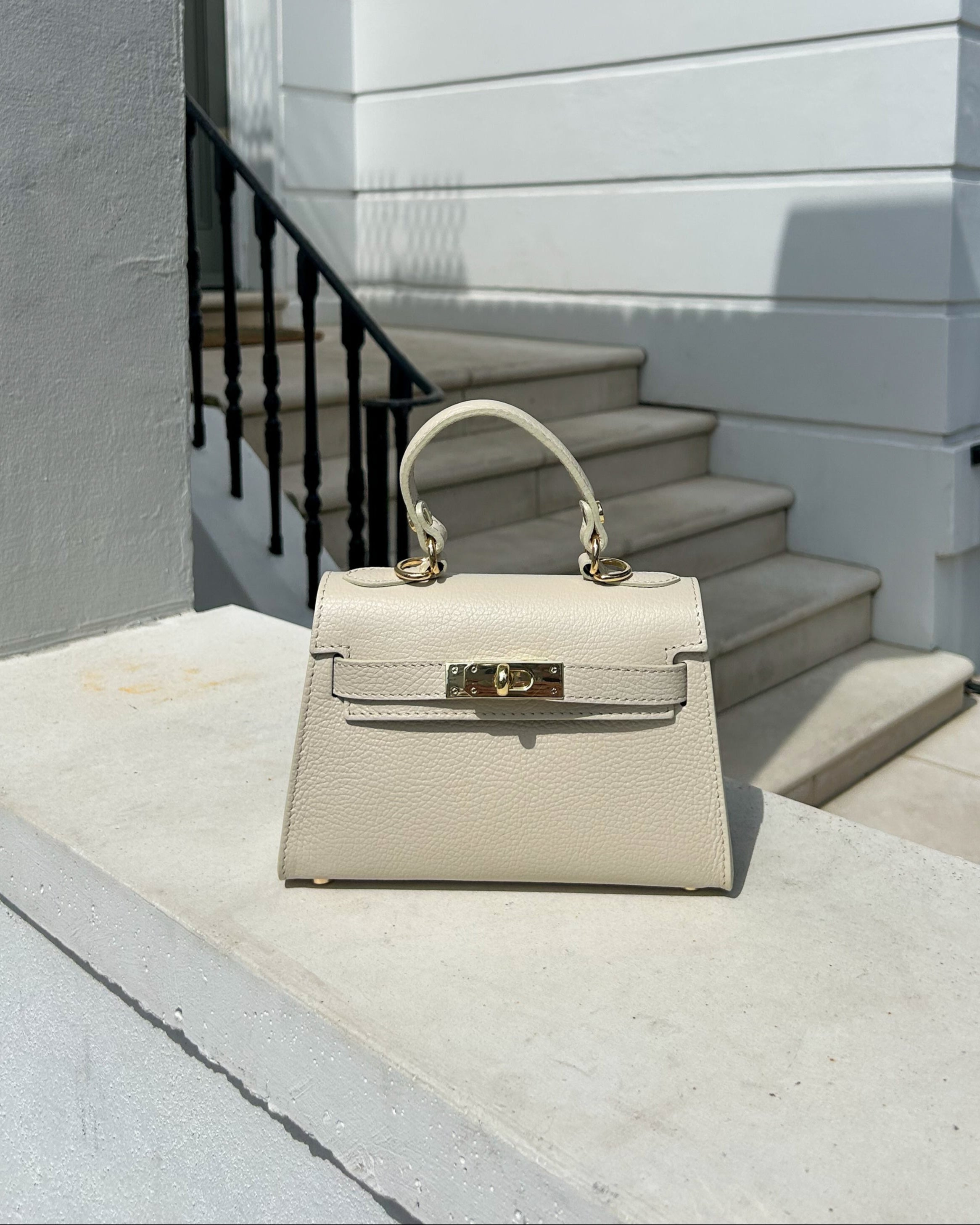 Calf leather top handle bag in beige