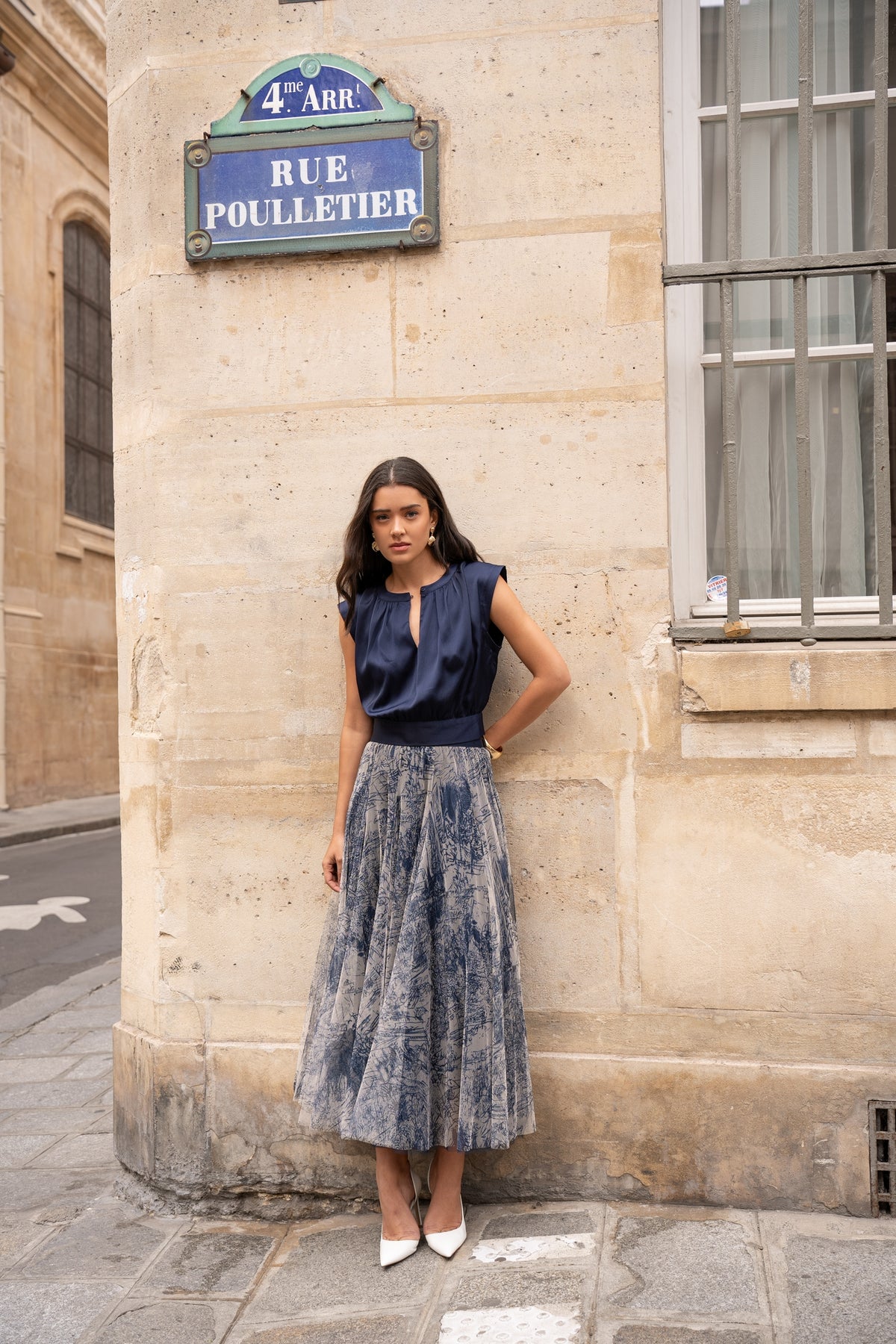 Model posing in the long navy blue tulle skirt.