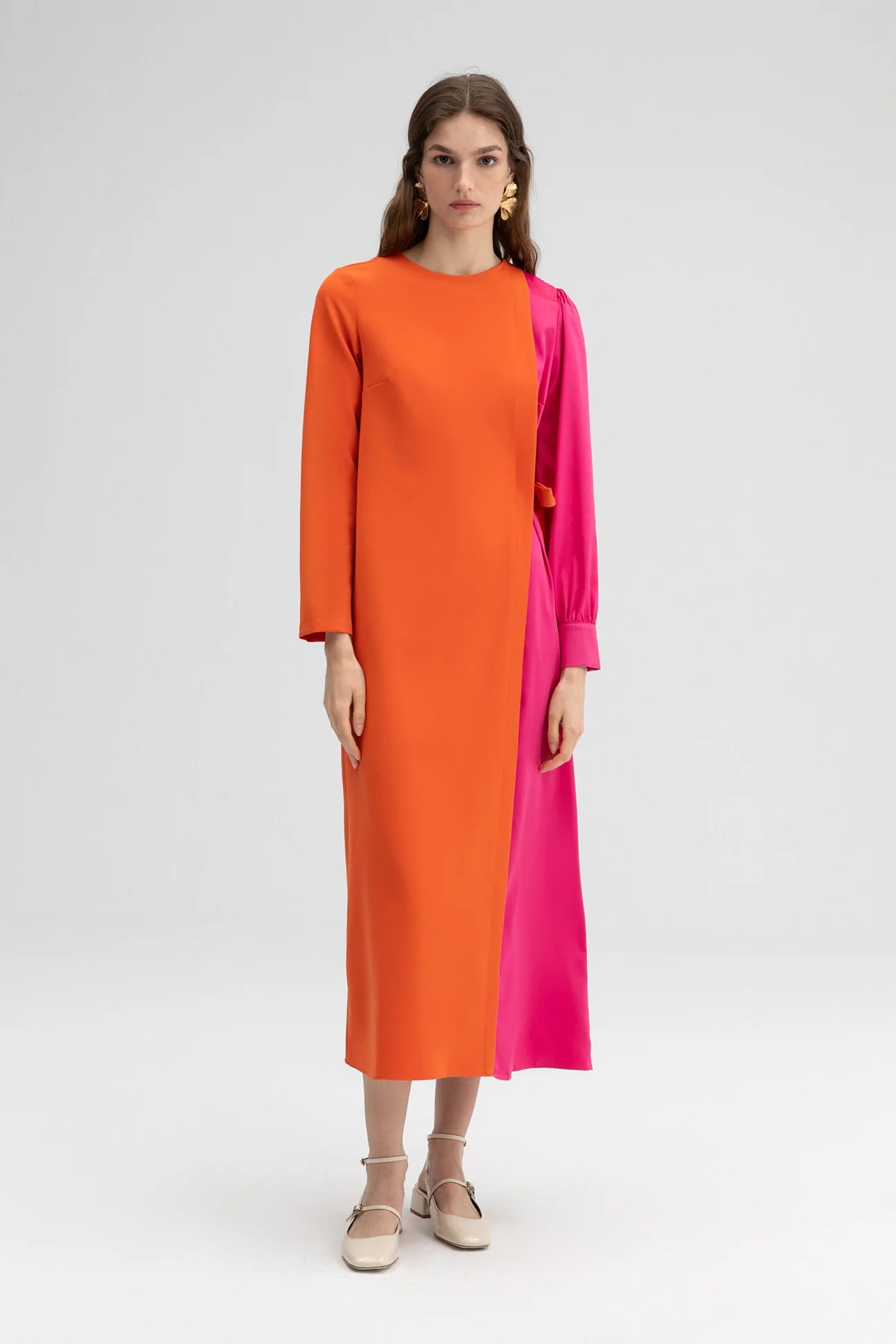 Long sleeve colour block dress styled for modern occasion wear