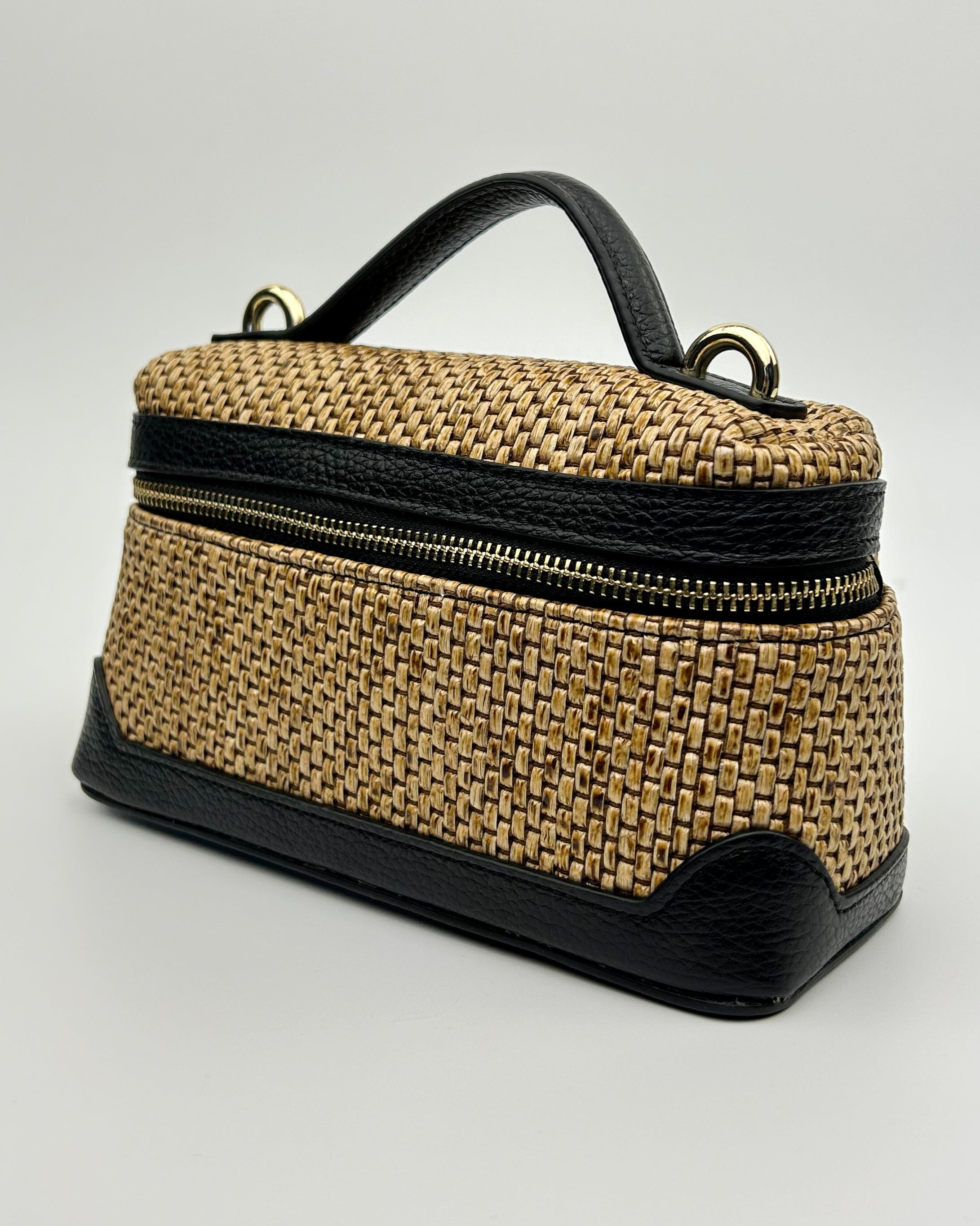 Front view of Sofia Vanity Bag in raffia and leather, blending texture with structured elegance
