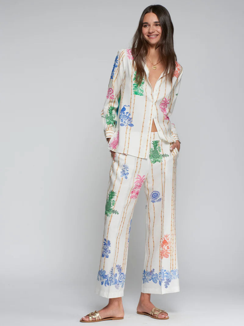 Woman wearing Vilagallo bamboo tropical print trousers - Spanish designer Tencel wide-leg pants outfit