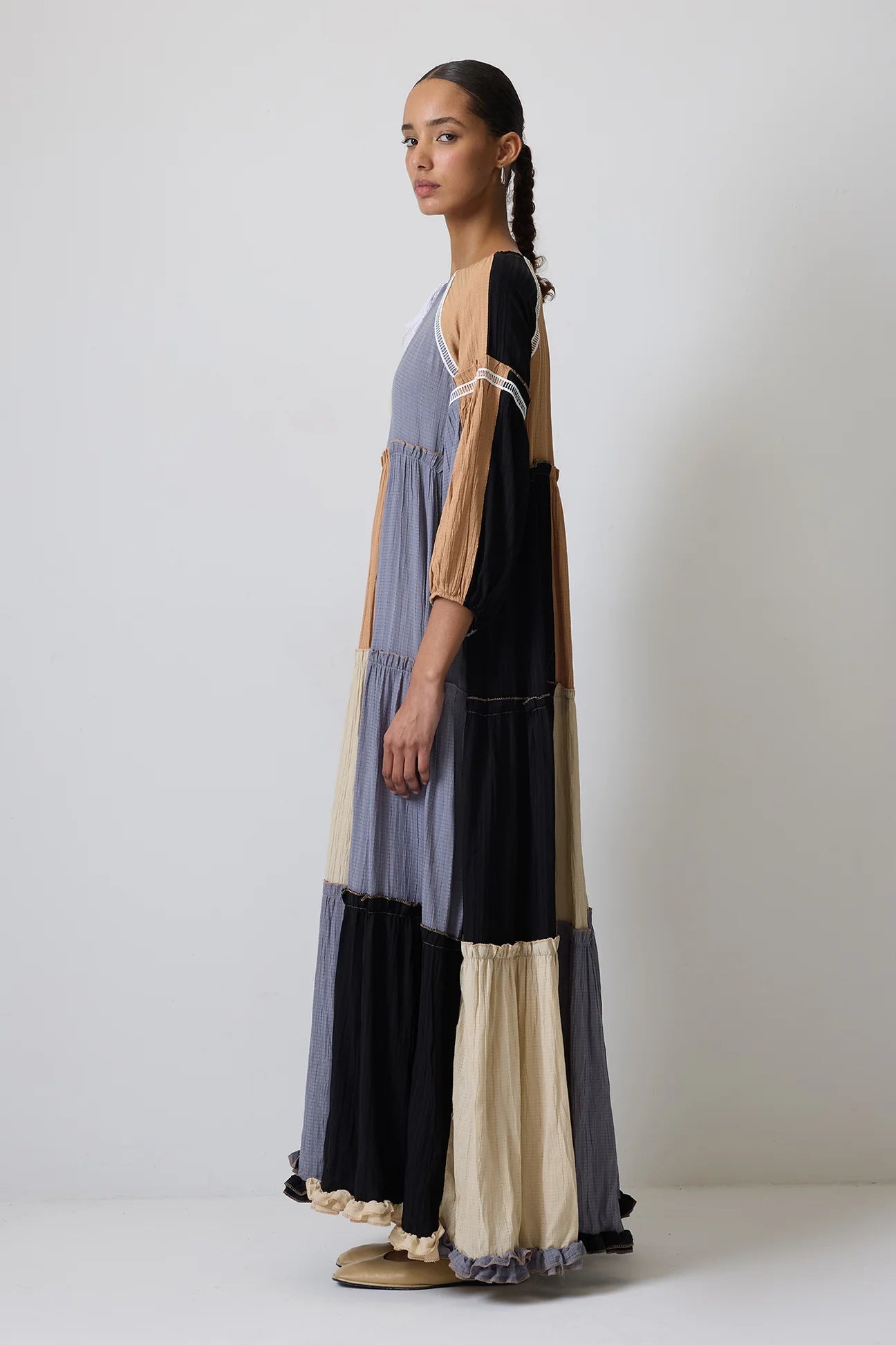 Side profile showing relaxed tiered silhouette of boho dress
