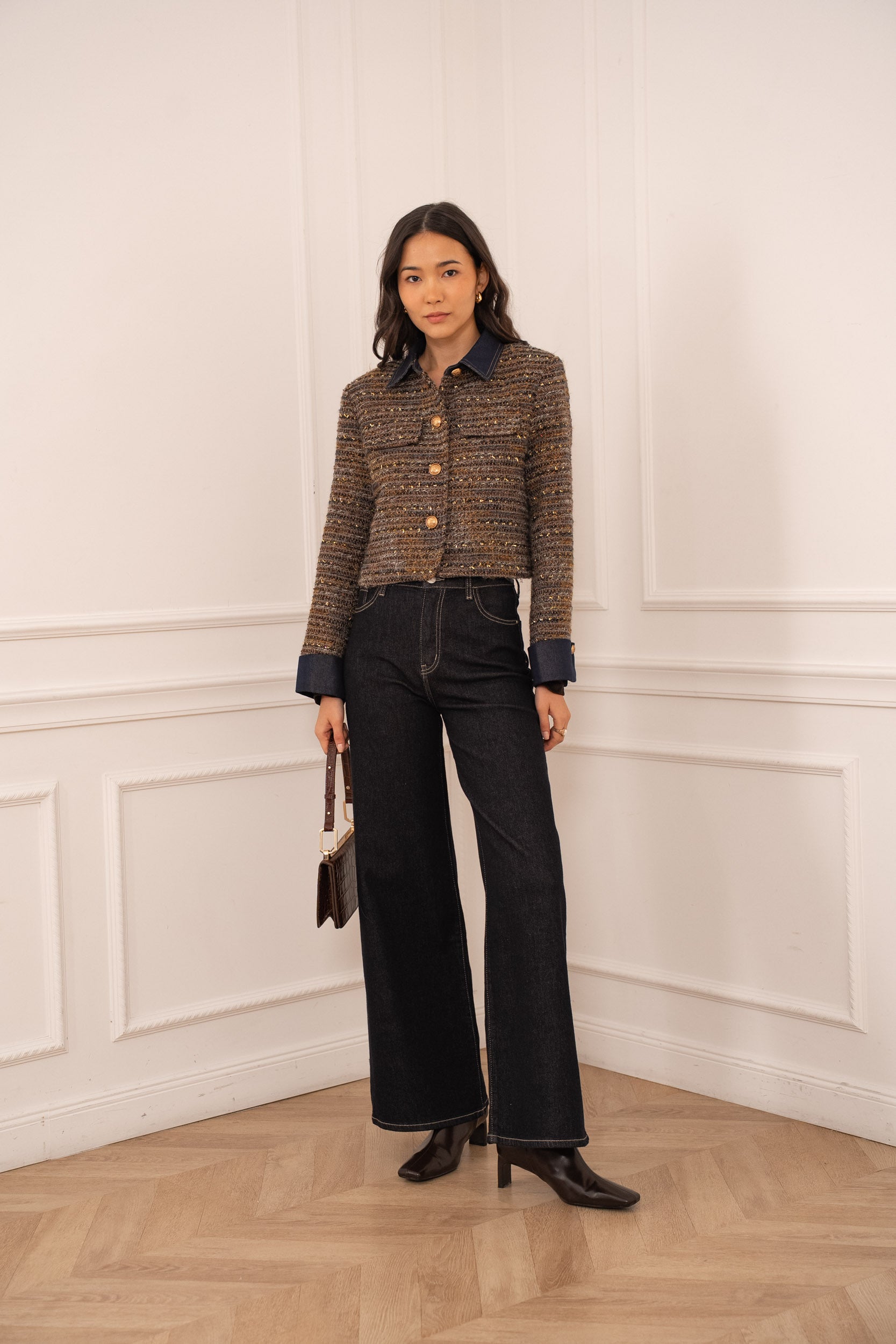Brown tweed jacket detail showing textured fabric and metallic shimmer