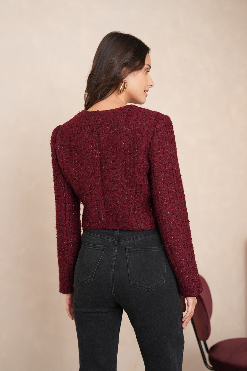 Wine tweed blazer close-up showing shimmer texture and bouclé fabric detail
