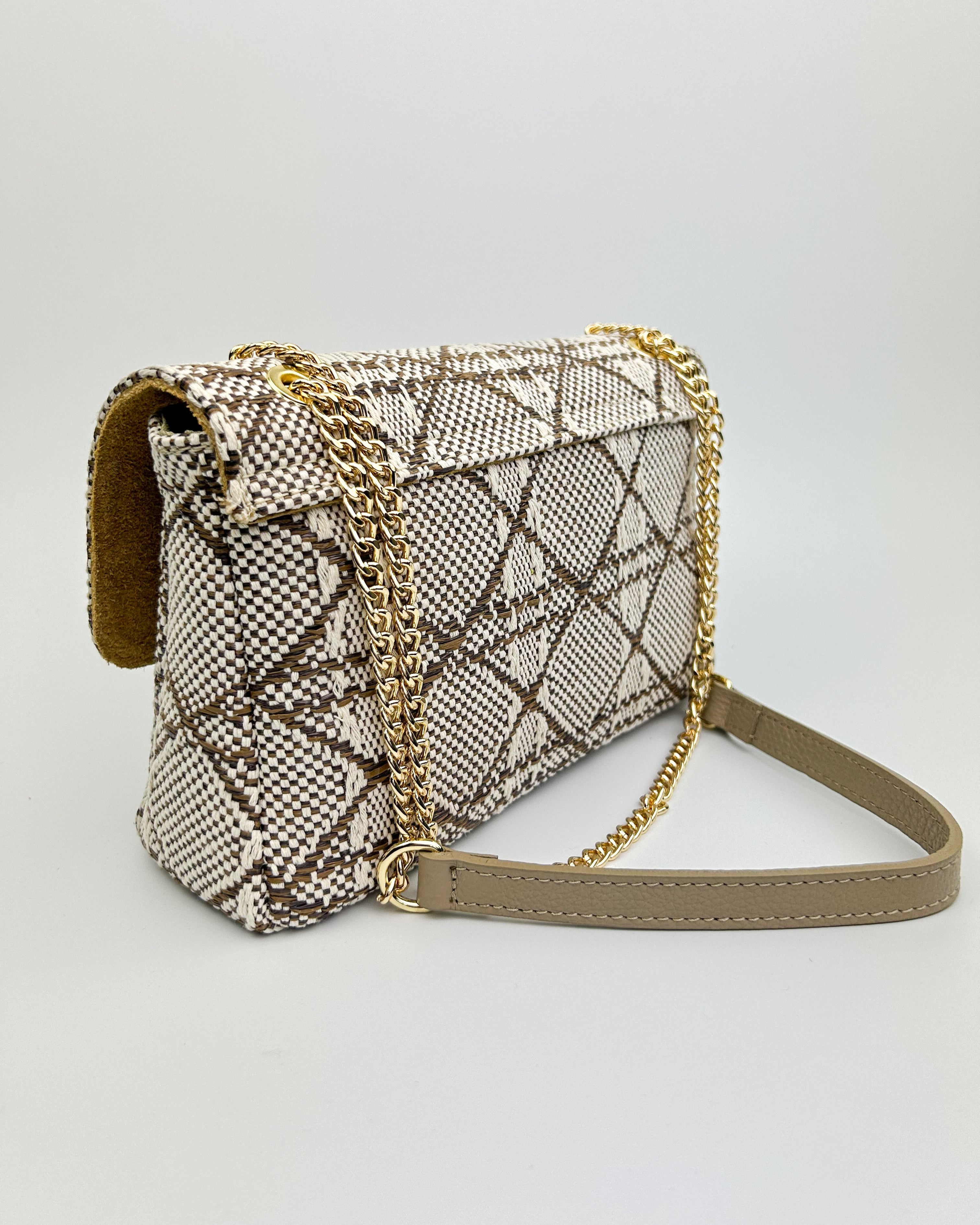 Side view of blue Emma bag with leather trim and long shoulder strap
