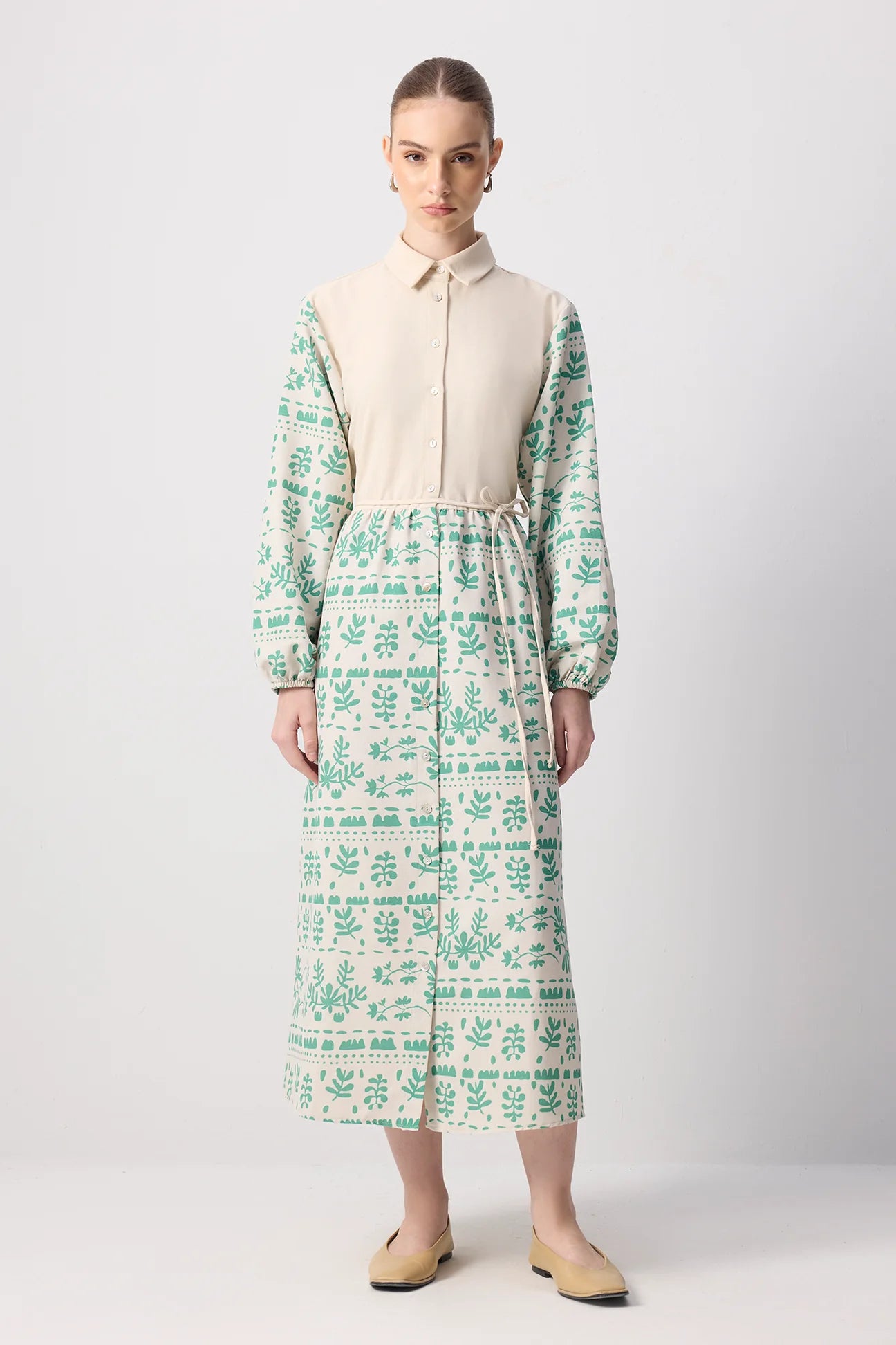 Model wearing modest floral shirt dress with collar and long sleeves