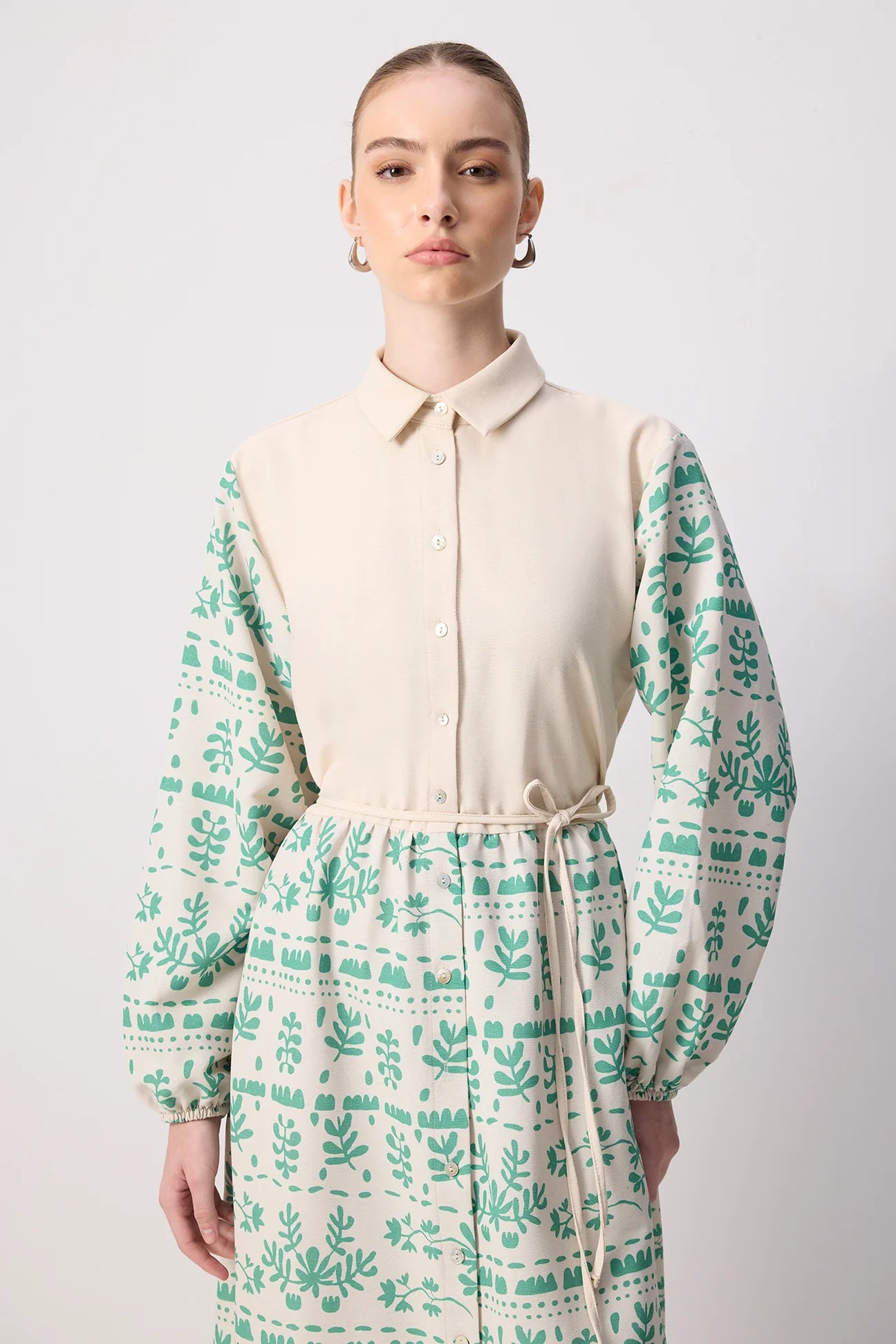 Front view of midi floral dress with tie waist and shirt collar