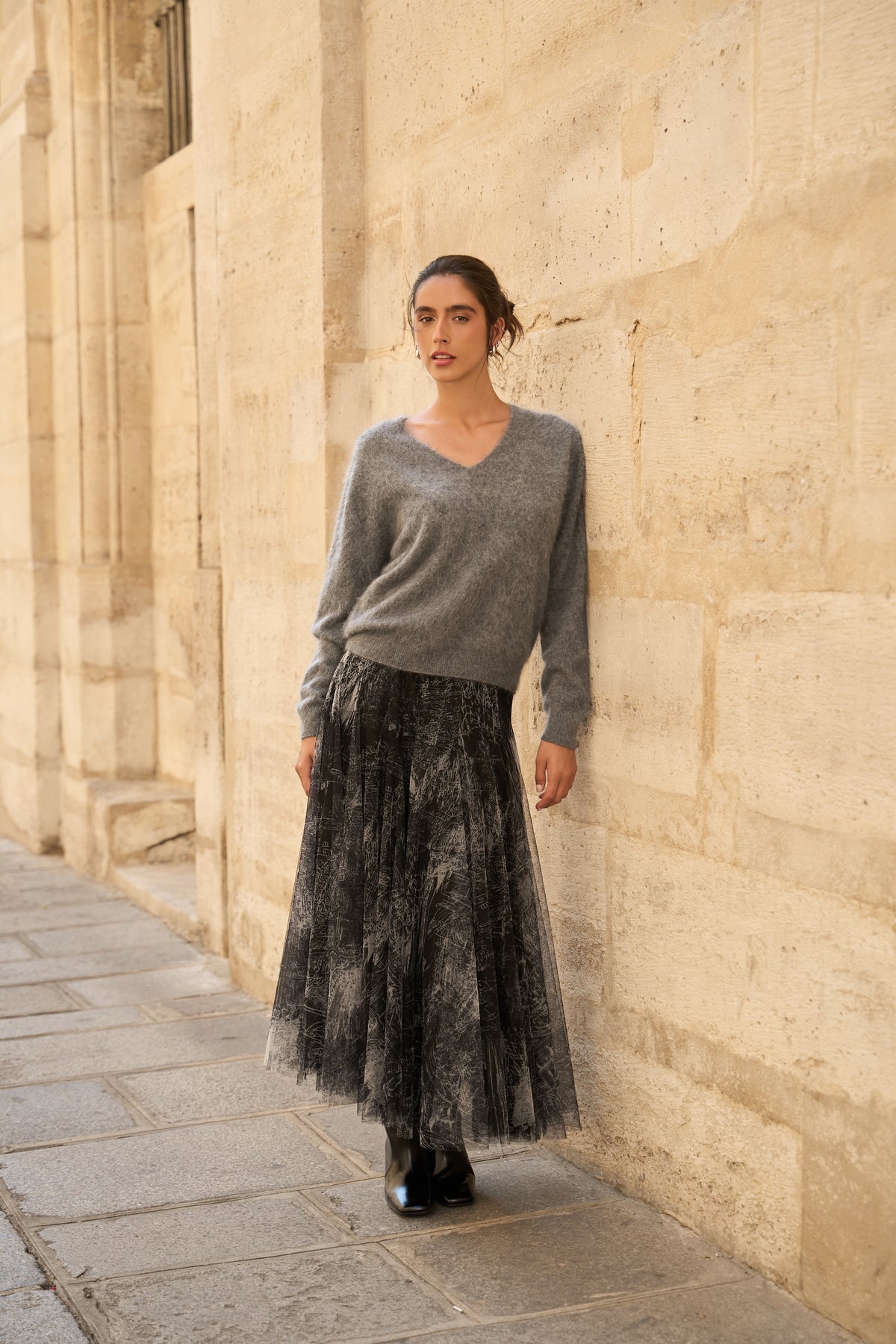 Women’s black tulle midi skirt with soft pleats and artistic tonal print