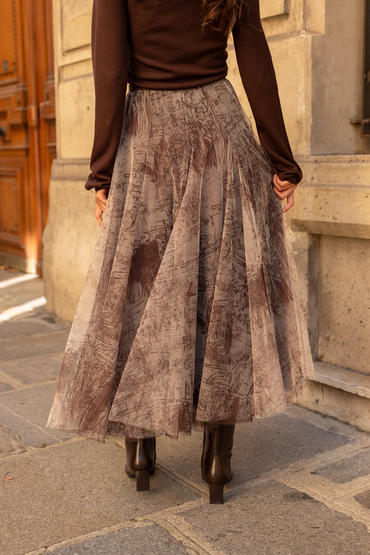Women’s brown tulle midi skirt with fitted waistband, soft pleats and statement print