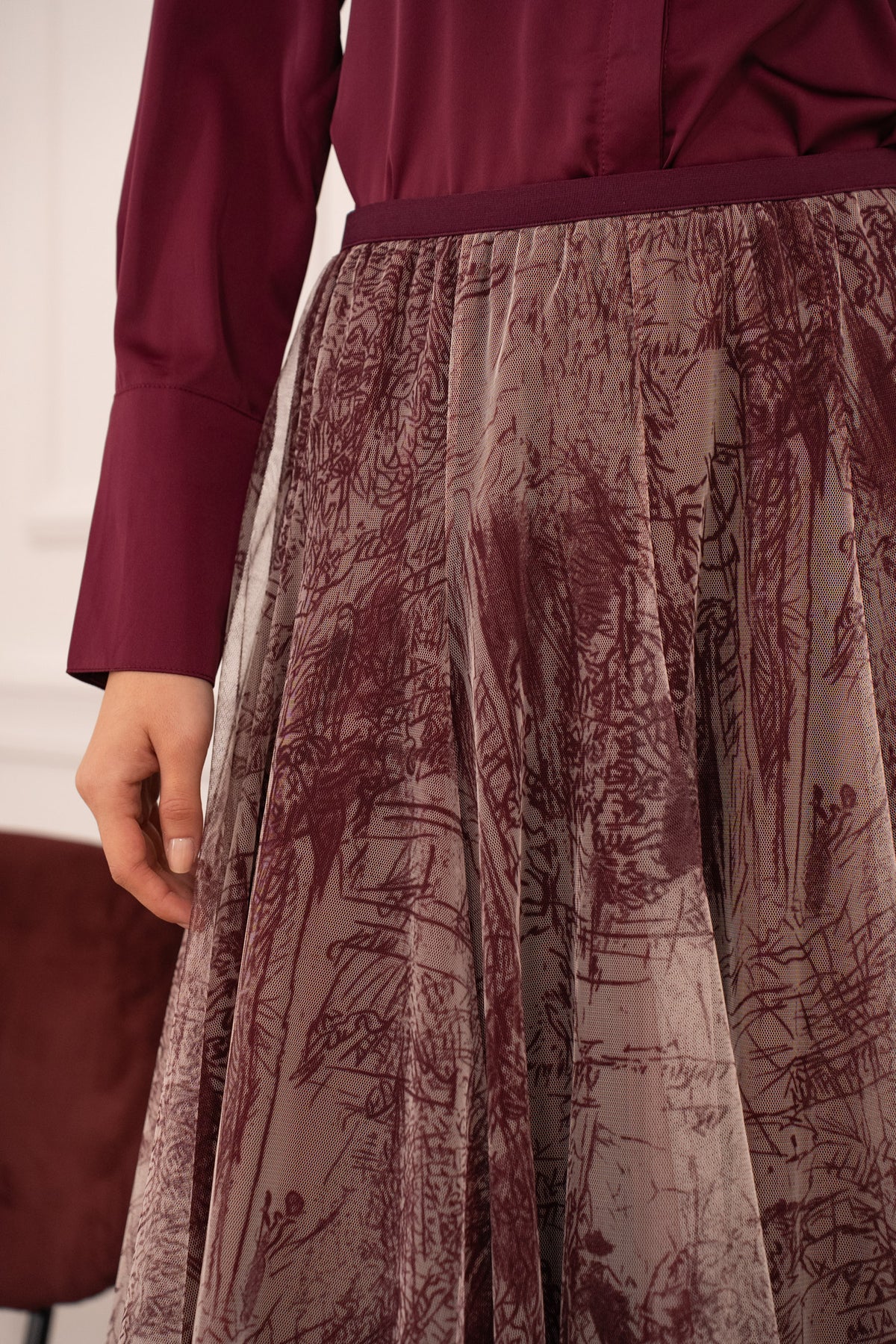 Elegant burgundy tulle midi skirt featuring an artistic sketch print and voluminous layered design.