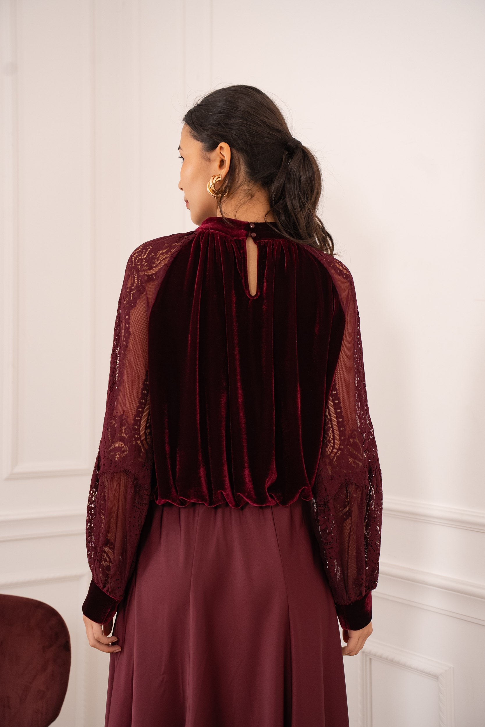 Long sleeve velvet blouse styled with burgundy trousers - autumn winter outfit