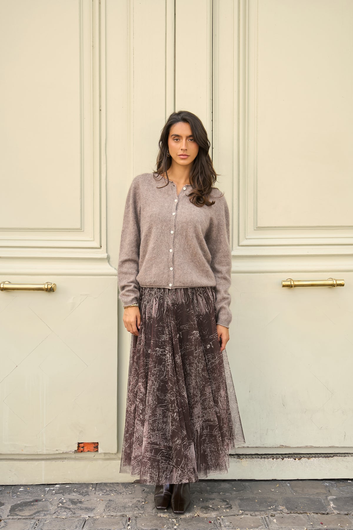 Dark brown printed tulle midi skirt with layered A-line silhouette and fitted waistband