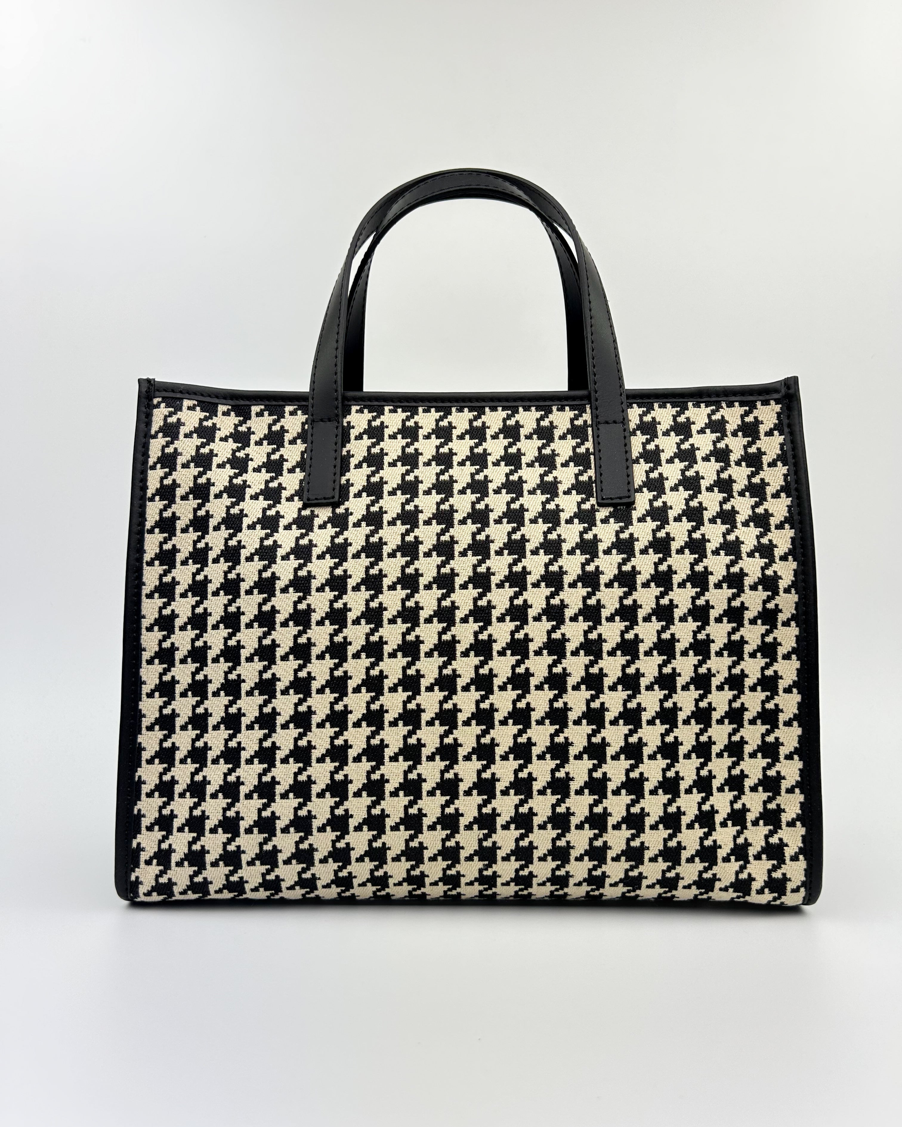 Emma Tote in black and white patterned fabric with black leather trim and structured form