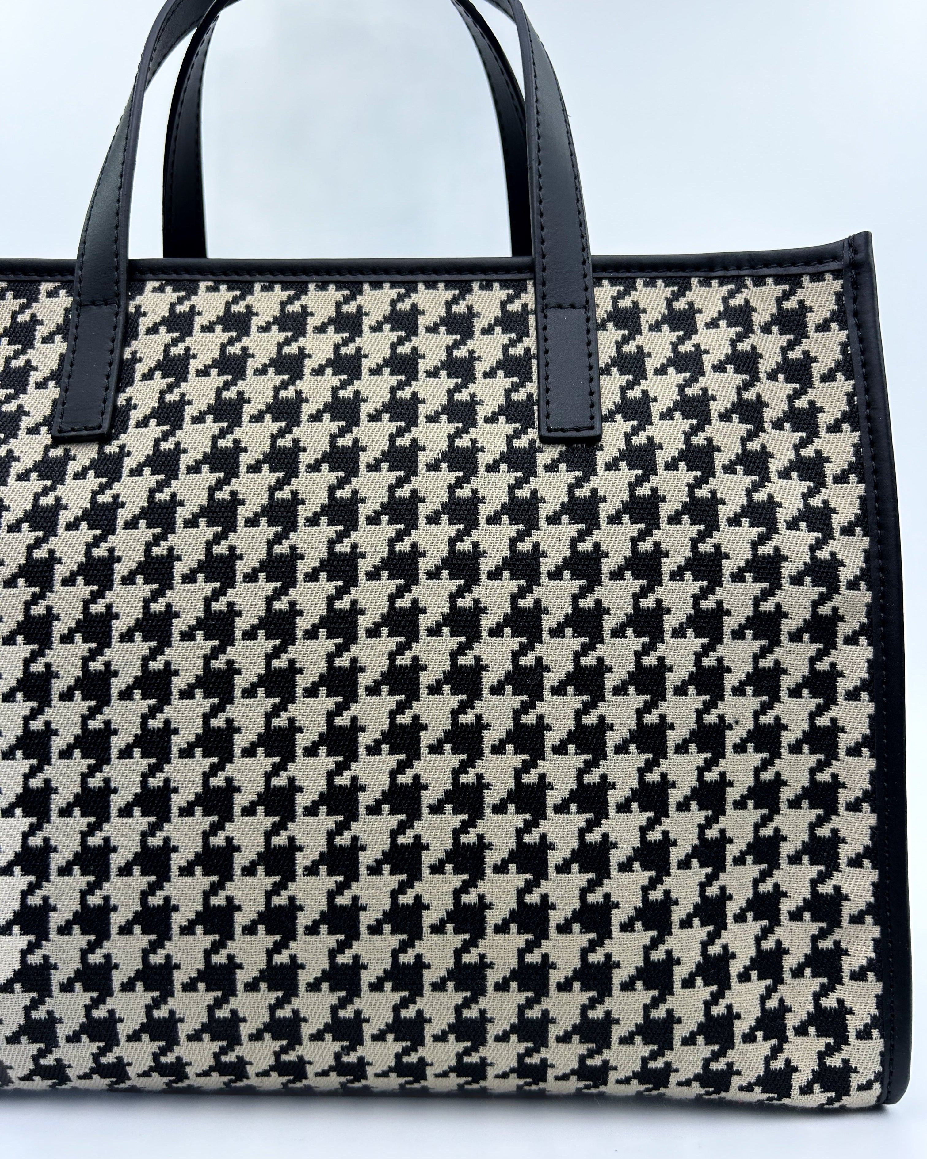Black and white Emma Tote with top handle and long strap, crafted in Italian leather