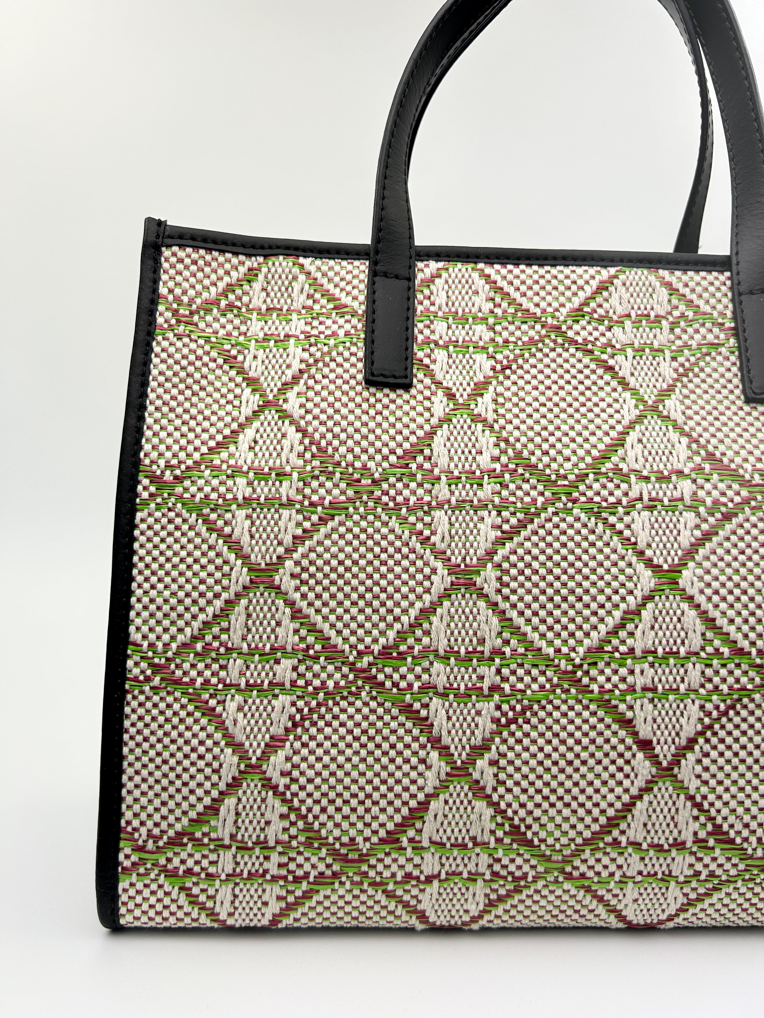 Close-up of Emma Tote showing woven fabric and fine Italian leather craftsmanship