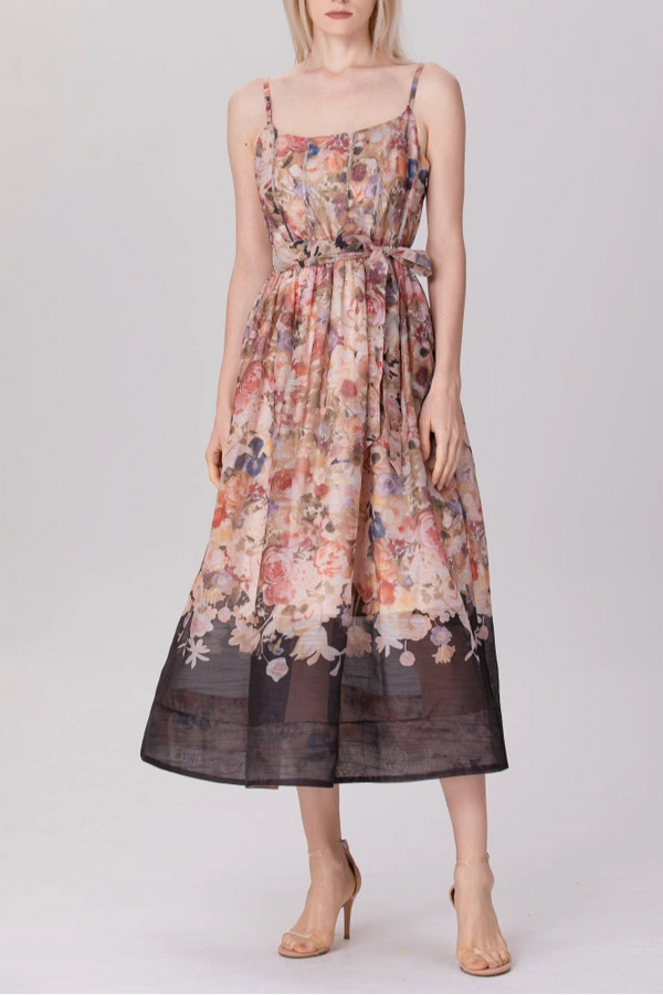 model in sleeveless floral organza midi dress with tie waist