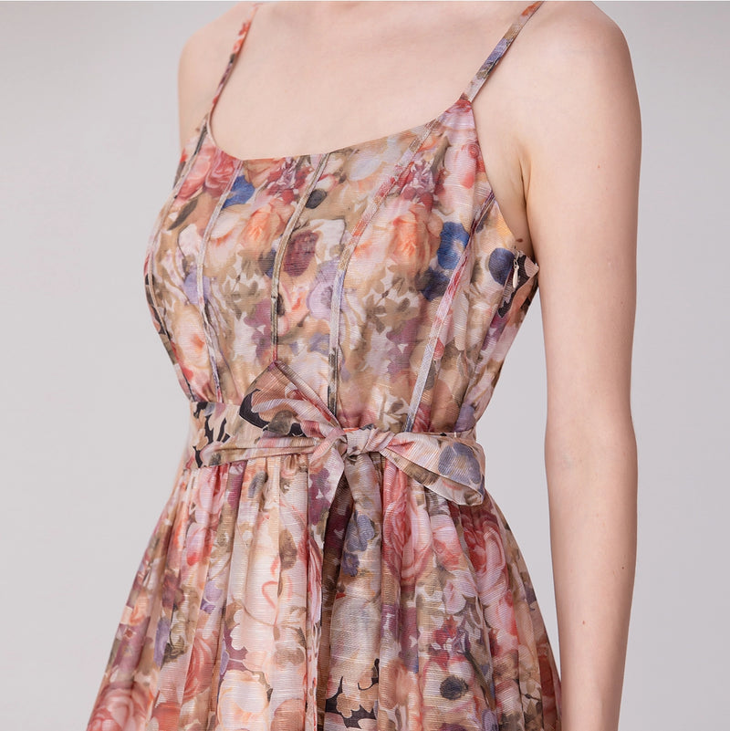 woman wearing sleeveless printed organza dress with heels

