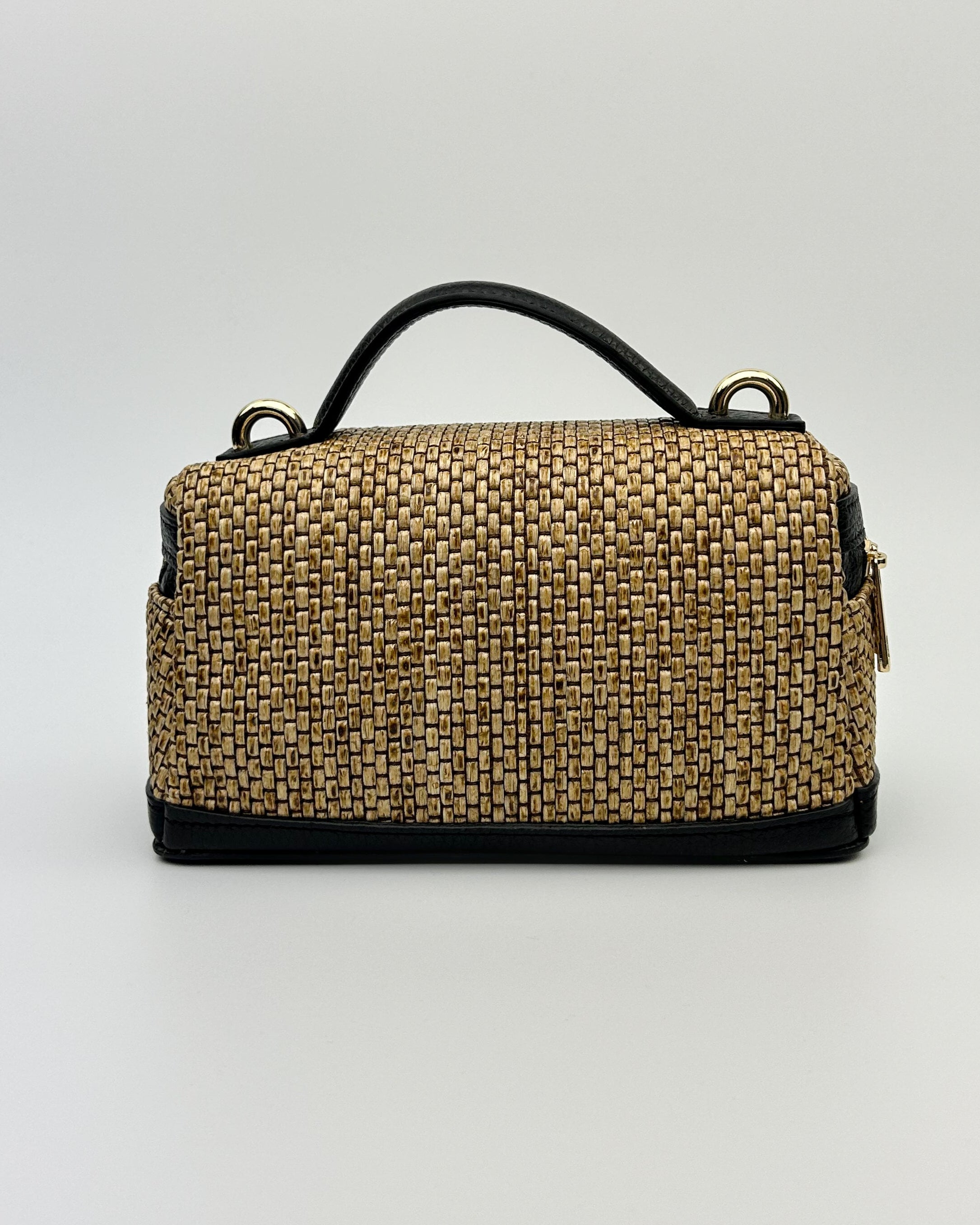 Versatile Sofia Vanity Bag in raffia and leather, designed with a top handle and crossbody strap
