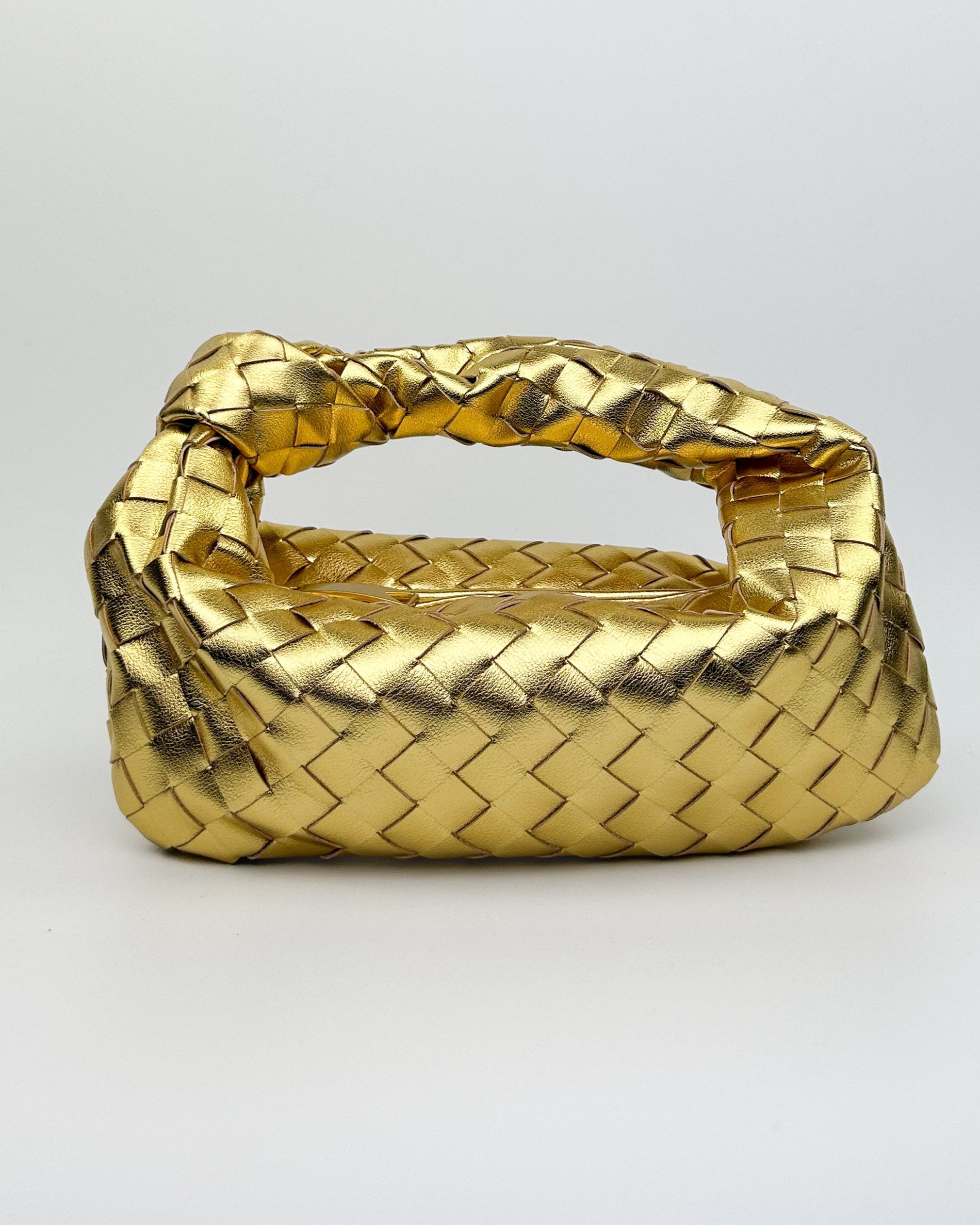 Gold leather knot handbag with crescent shape, woven Italian calf leather design – front view