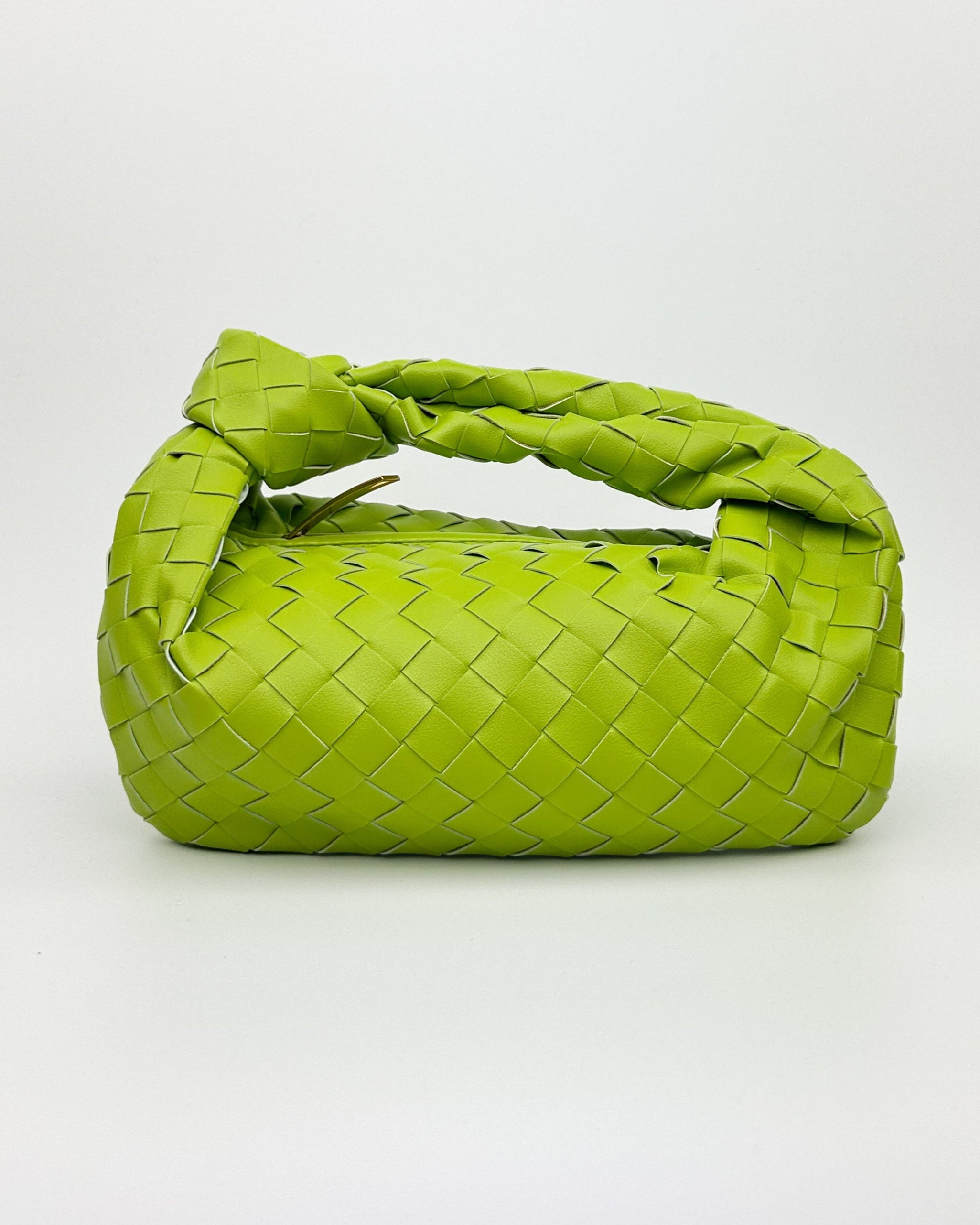 Lime green woven leather handbag with crescent silhouette and knotted top handle – Italian designer shoulder bag front view