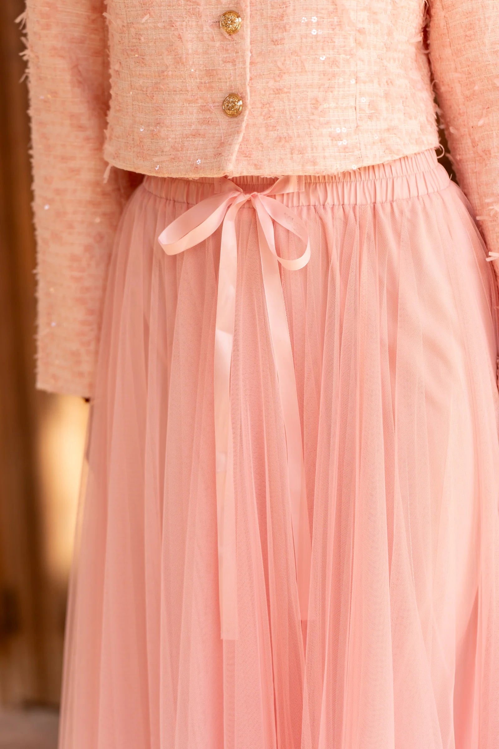 Simple pink mesh midi skirt styled for weddings and occasion wear