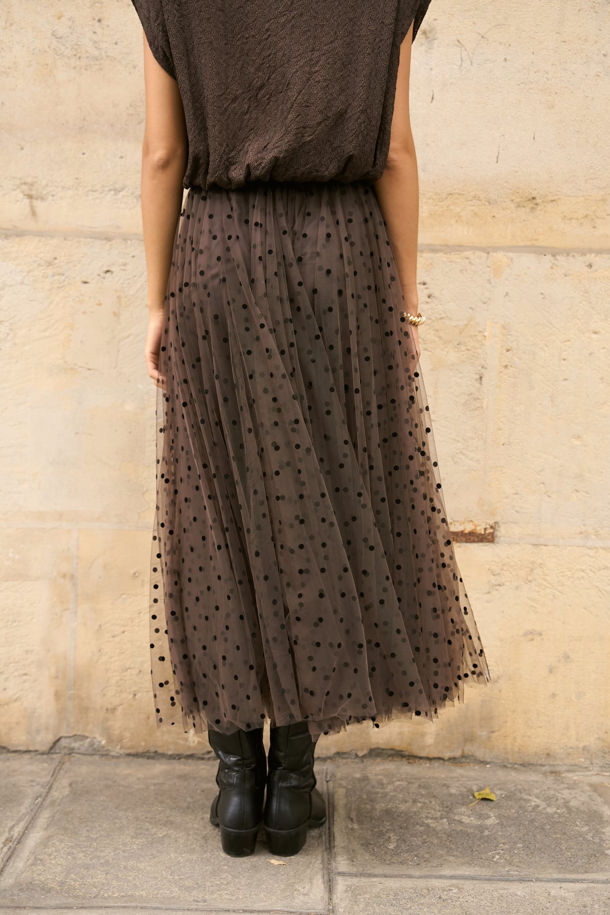 Back view of brown polka dot tulle midi skirt showing full layered flowing silhouette