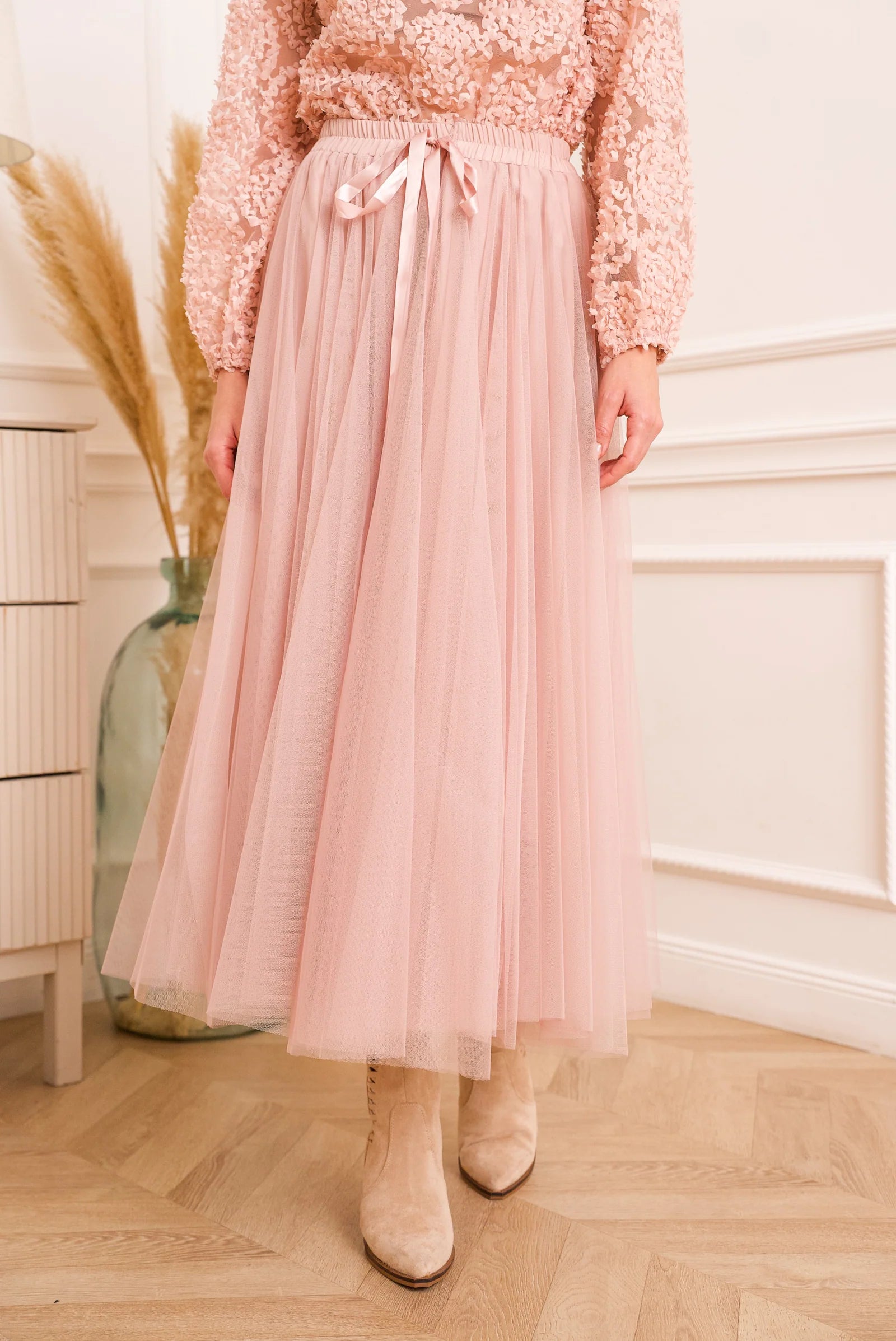 Feminine blush tulle skirt with lightweight layers and timeless silhouette