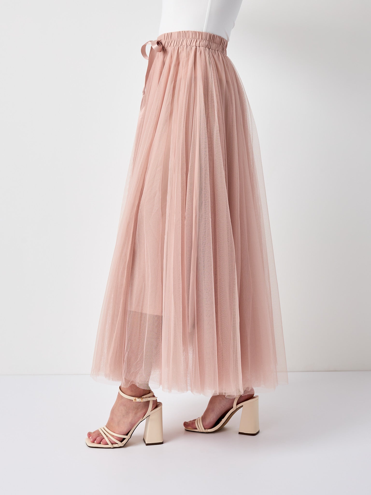Pink tulle midi skirt styled for garden party — Sienna Alexander London
