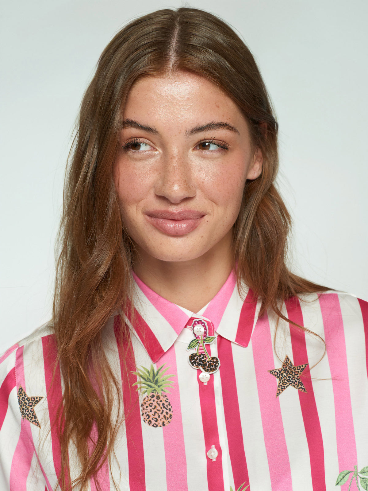 Printed women’s shirt with fruit motifs and striped pattern